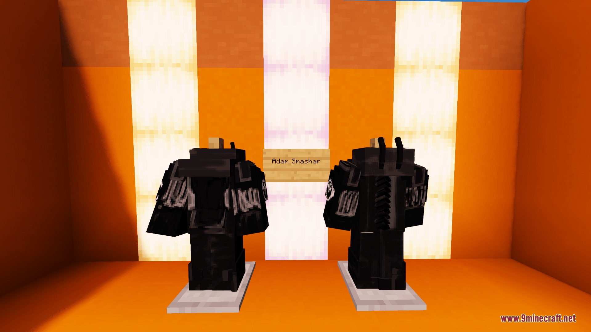 Two armor stands displaying heavy black Adam Smasher exoskeleton armor sets