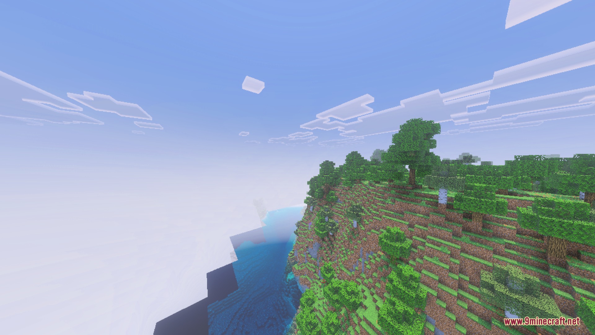A scenic view of a forested cliff overlooking the ocean in Minecraft