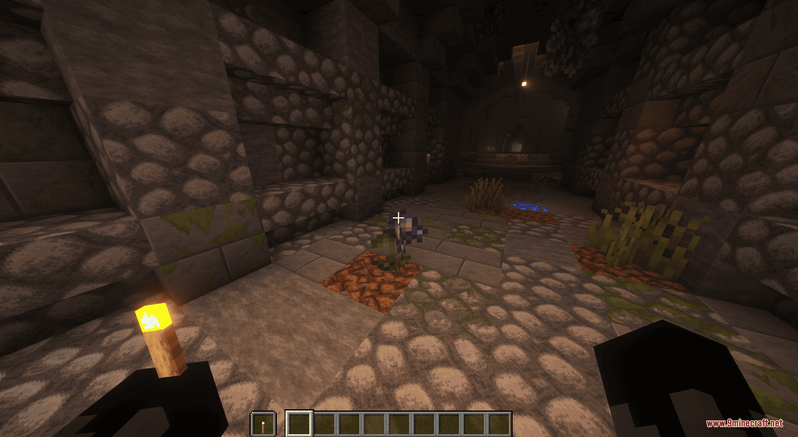 Nirn Soul Alchemy Mod Screenshot 3 Player holding a torch while looking at a Deathbell plant in a dungeon