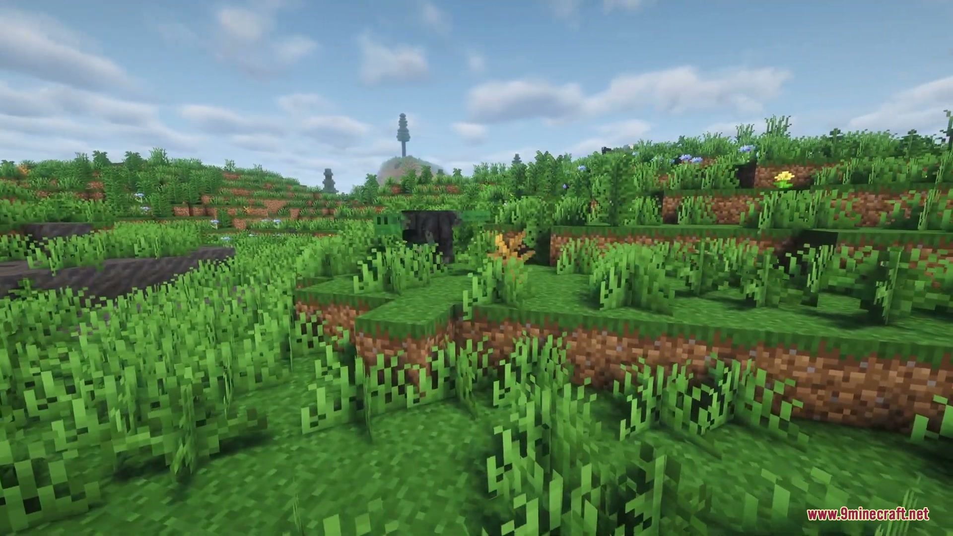 Nomad Horizon Expanded Mod Screenshot 3 A dark prehistoric dinosaur stands behind tall grass in a lush field