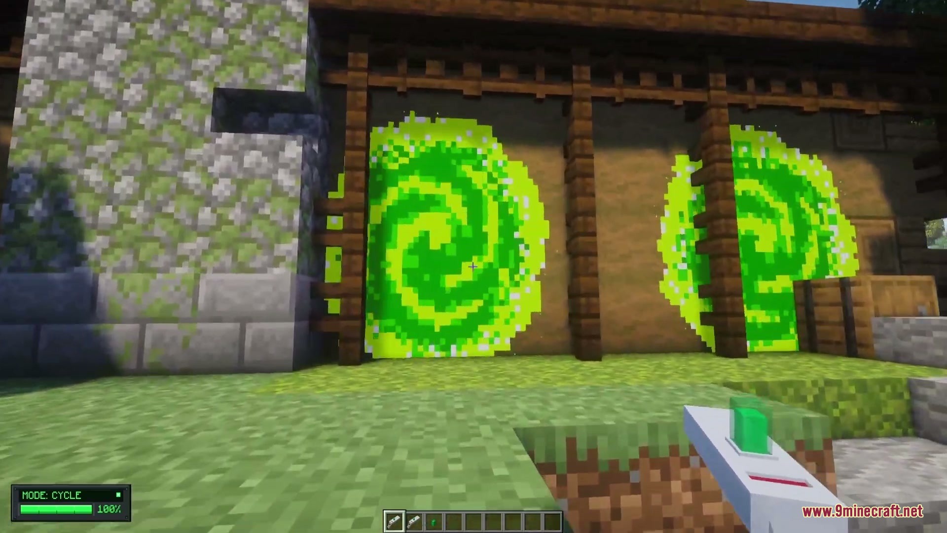 Omni Gear Collection Mod Screenshot 3 A player holding a portal gun facing a large green swirling portal