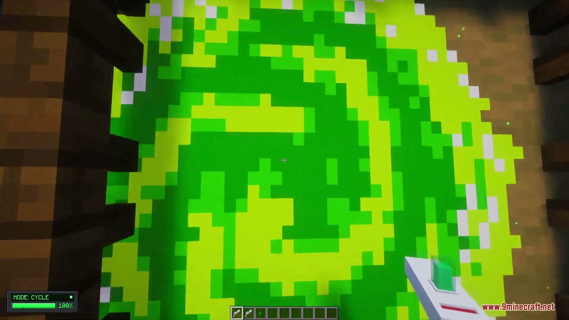 Omni Gear Collection Mod Screenshot 4 Close up view of a glowing green swirling portal in Minecraft