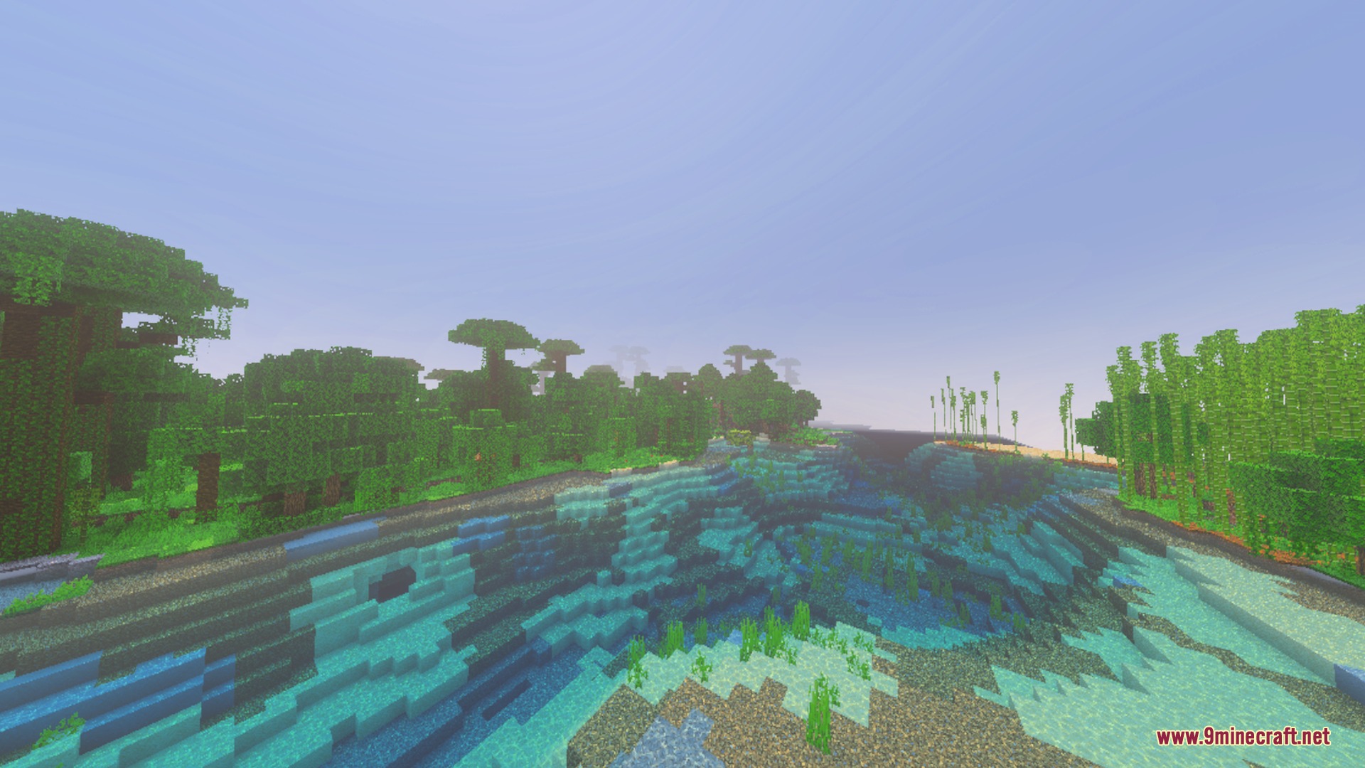 Vibrant jungle and bamboo forest bordering a clear blue river in Minecraft world
