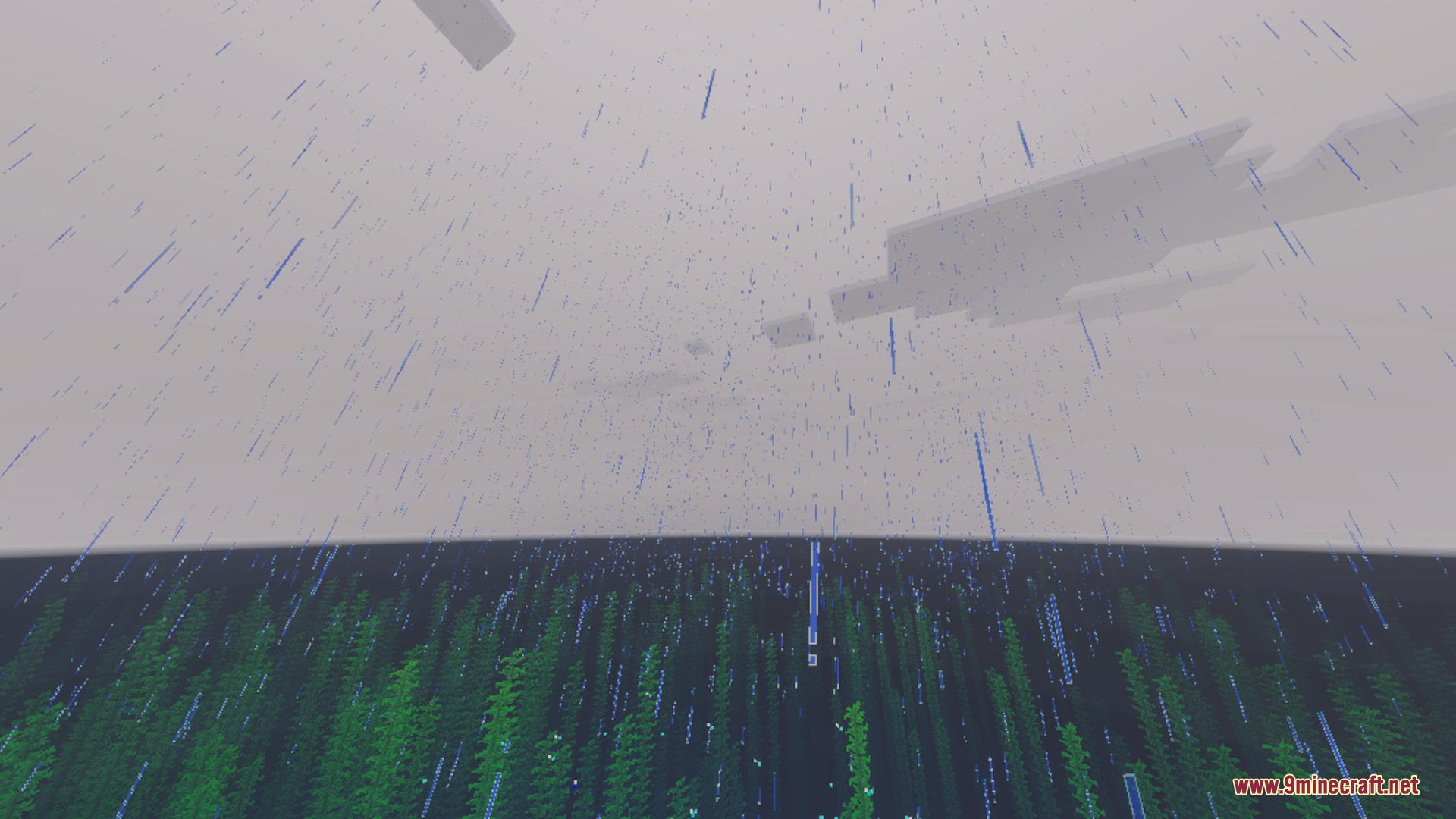 Heavy rain falling over a dark forest under a grey overcast sky