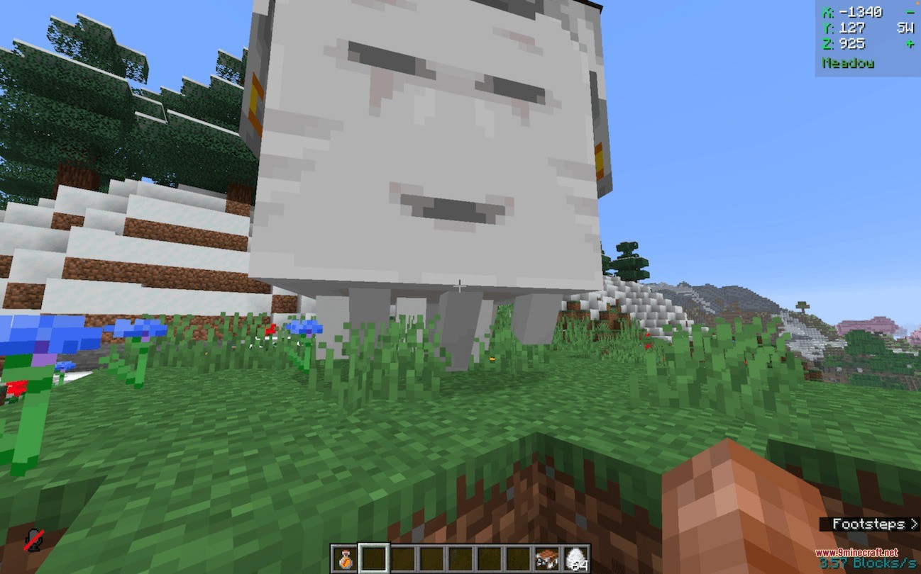 A close up view of a friendly Happy Ghast in a grassy biome