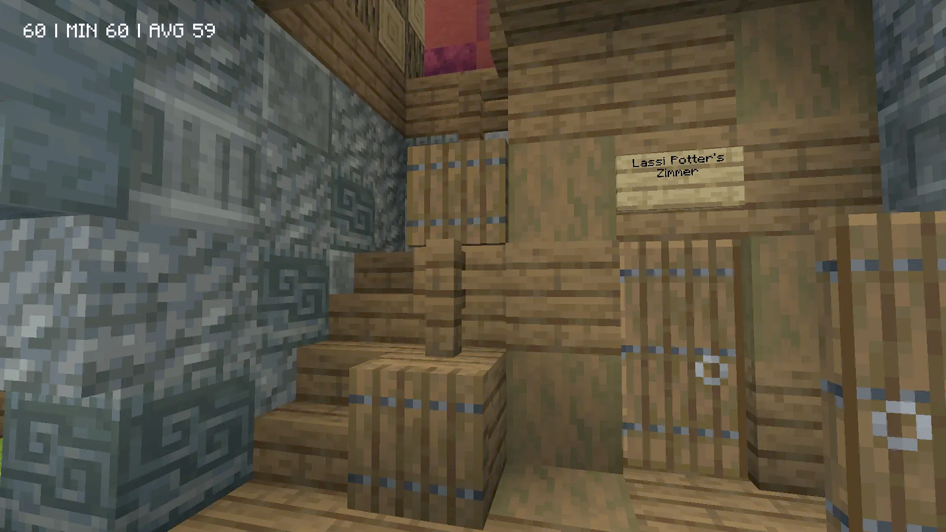 A cozy room built under wooden stairs with barrels and signs