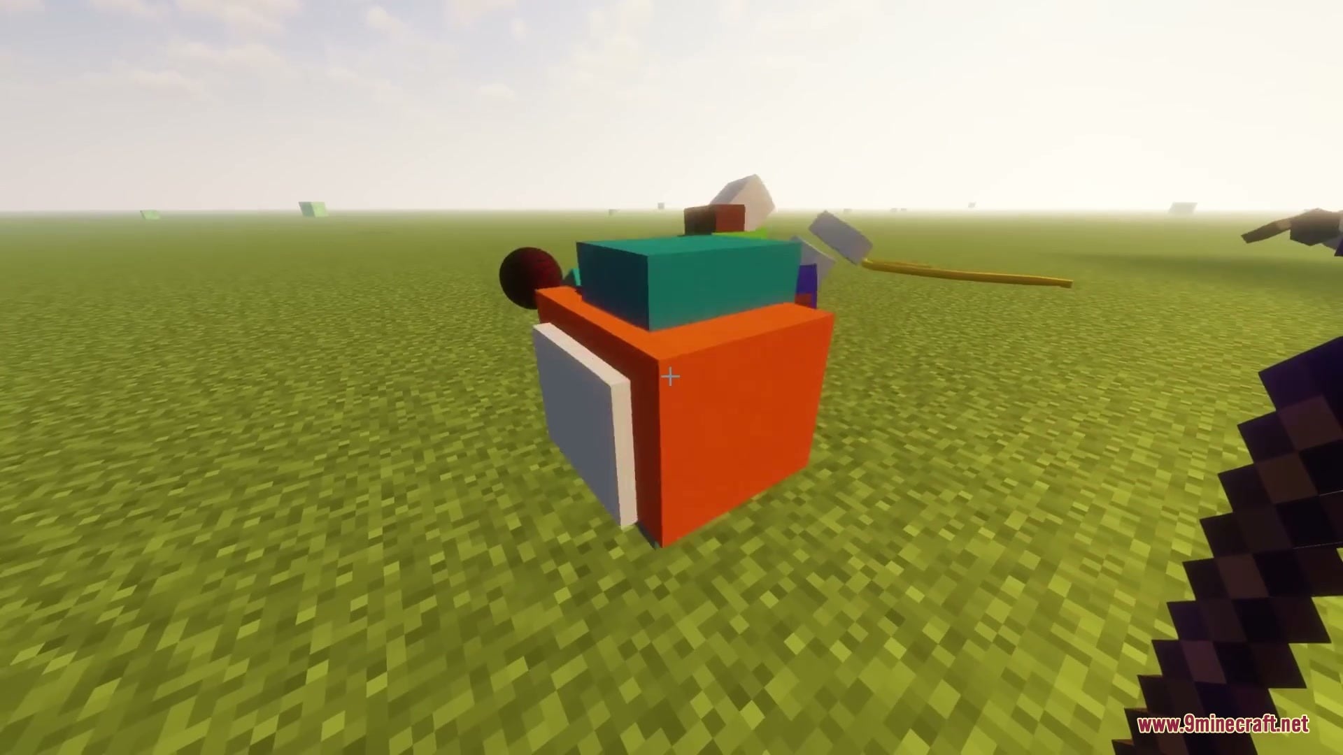 Primal Aether Surge Mod Screenshot 12 Large orange and teal physics blocks are placed on a flat grassy field