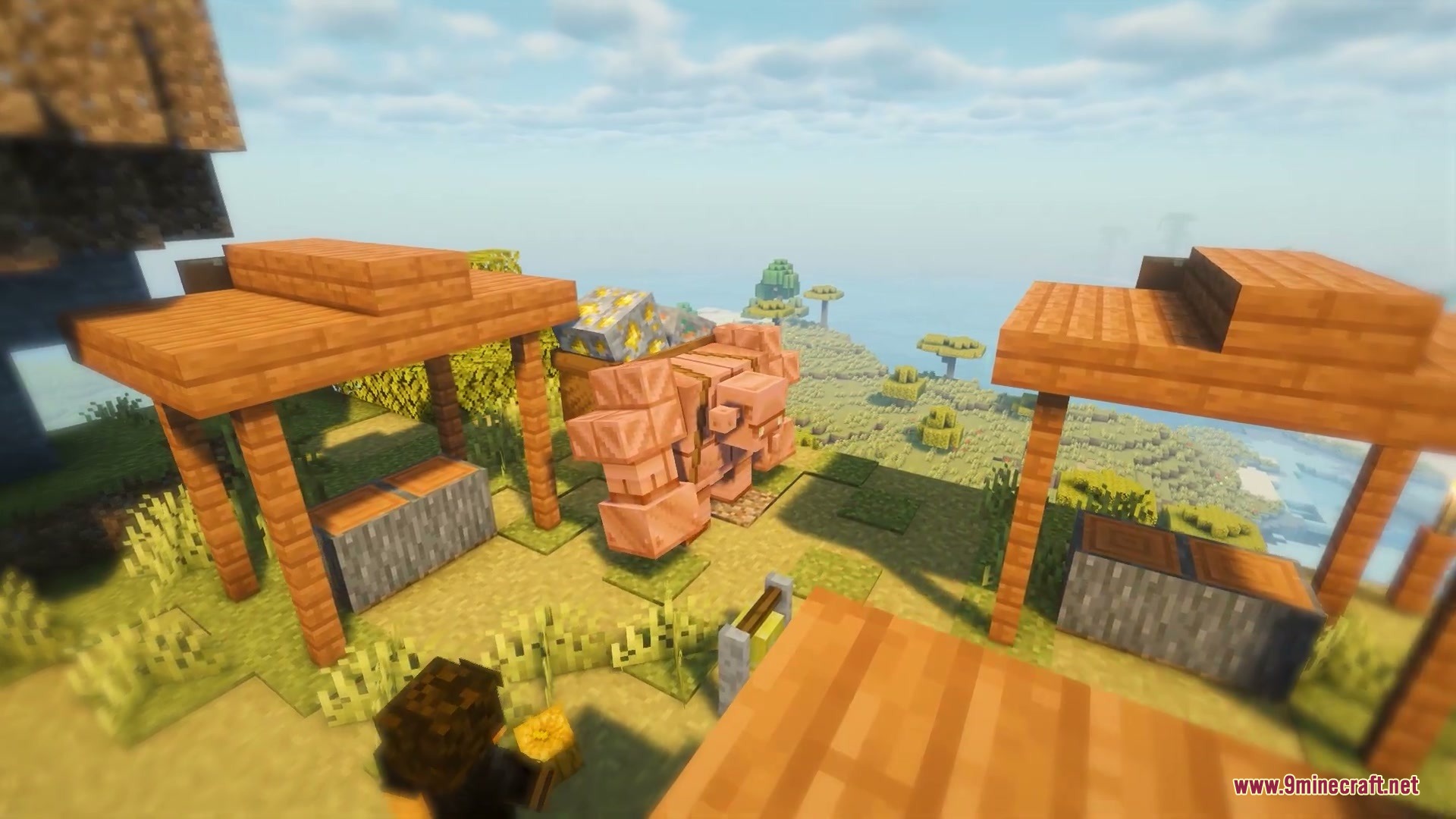 Primal Appetite Mod Screenshot 1 A large copper golem carrying gold ore stands near wooden market stalls