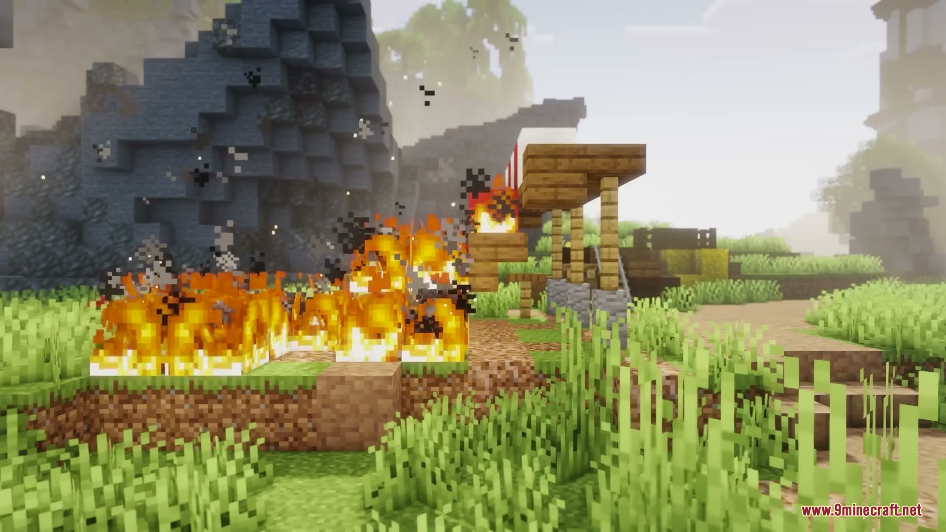 Primal Appetite Mod Screenshot 11 Flames spread across the grass and wooden blocks in a sunny Minecraft world