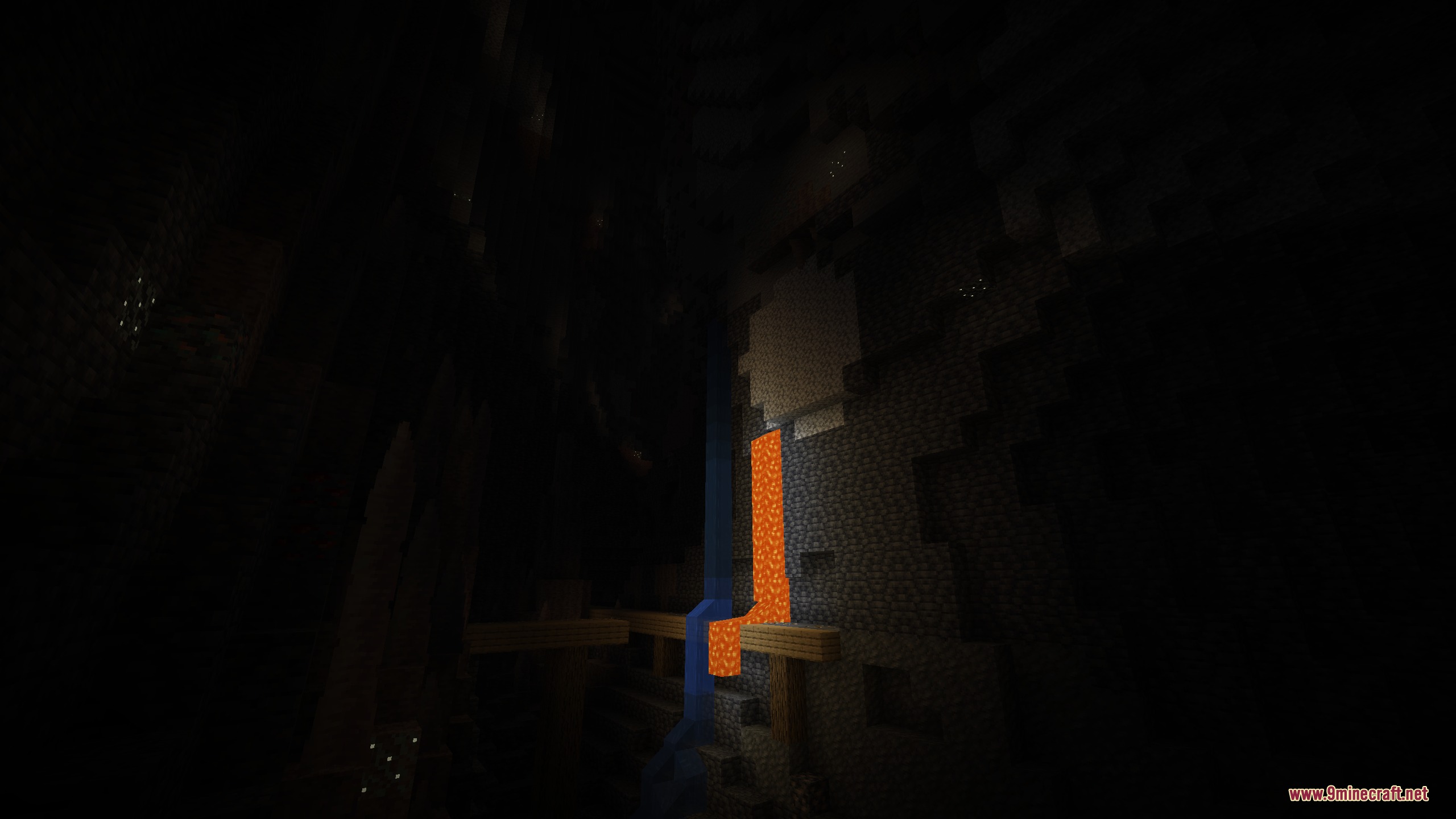 Prismatic Bloom Aura Mod Screenshot 1 Lava and water flow down a dark cave wall near a wooden mineshaft