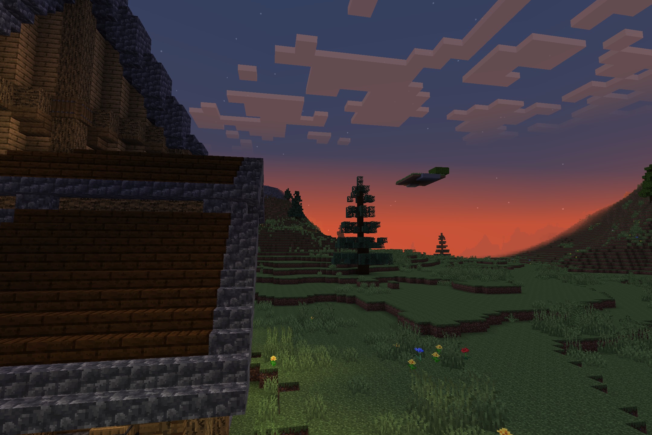 Prismic Patterned Depth Resource Pack Screenshot 10 A house roof overlooks a grassy field with pine trees at sunset
