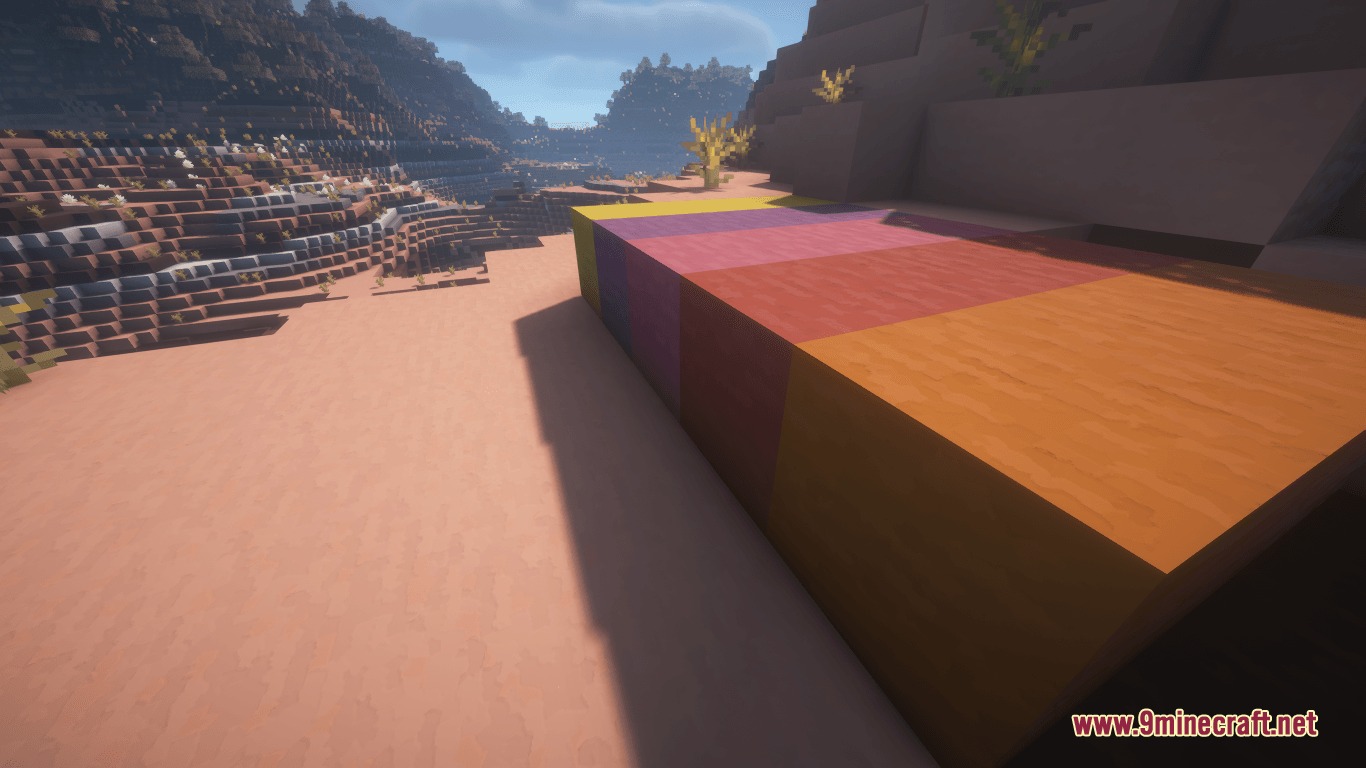 Prismic Patterned Depth Resource Pack Screenshot 7 A row of colorful blocks with geometric patterns placed in a desert