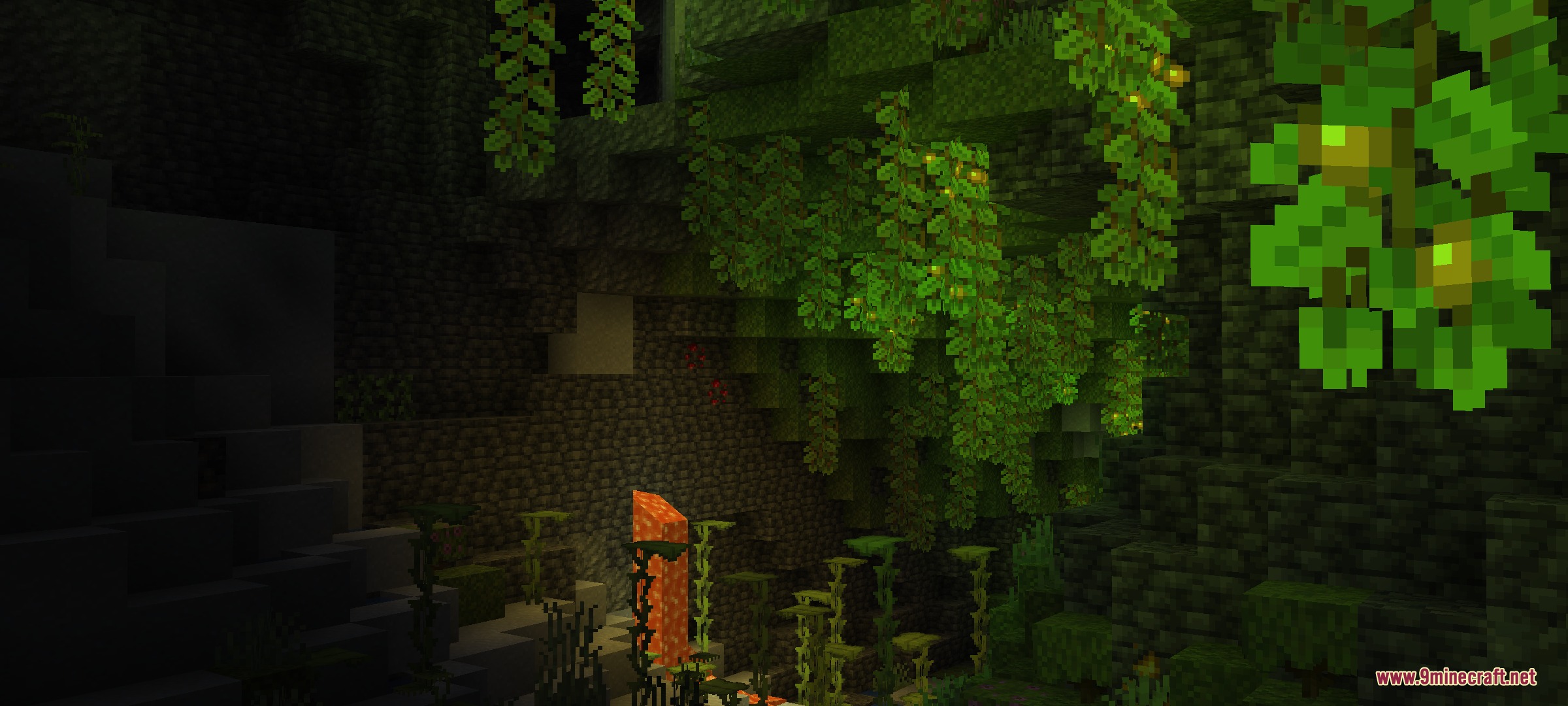 Lush cave illuminated by glowing berries and vines with soft green light