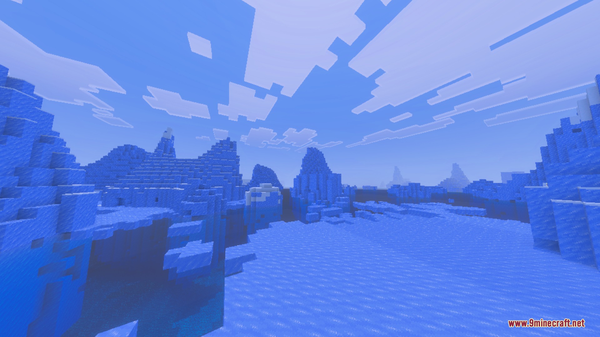 A vast frozen landscape featuring tall ice spikes under a bright blue sky
