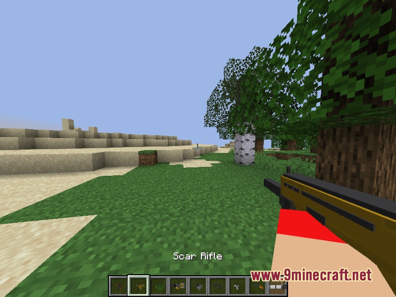Relic Firepower Mod Screenshot 5 Player wielding a yellow Scar Rifle in a grassy Minecraft world