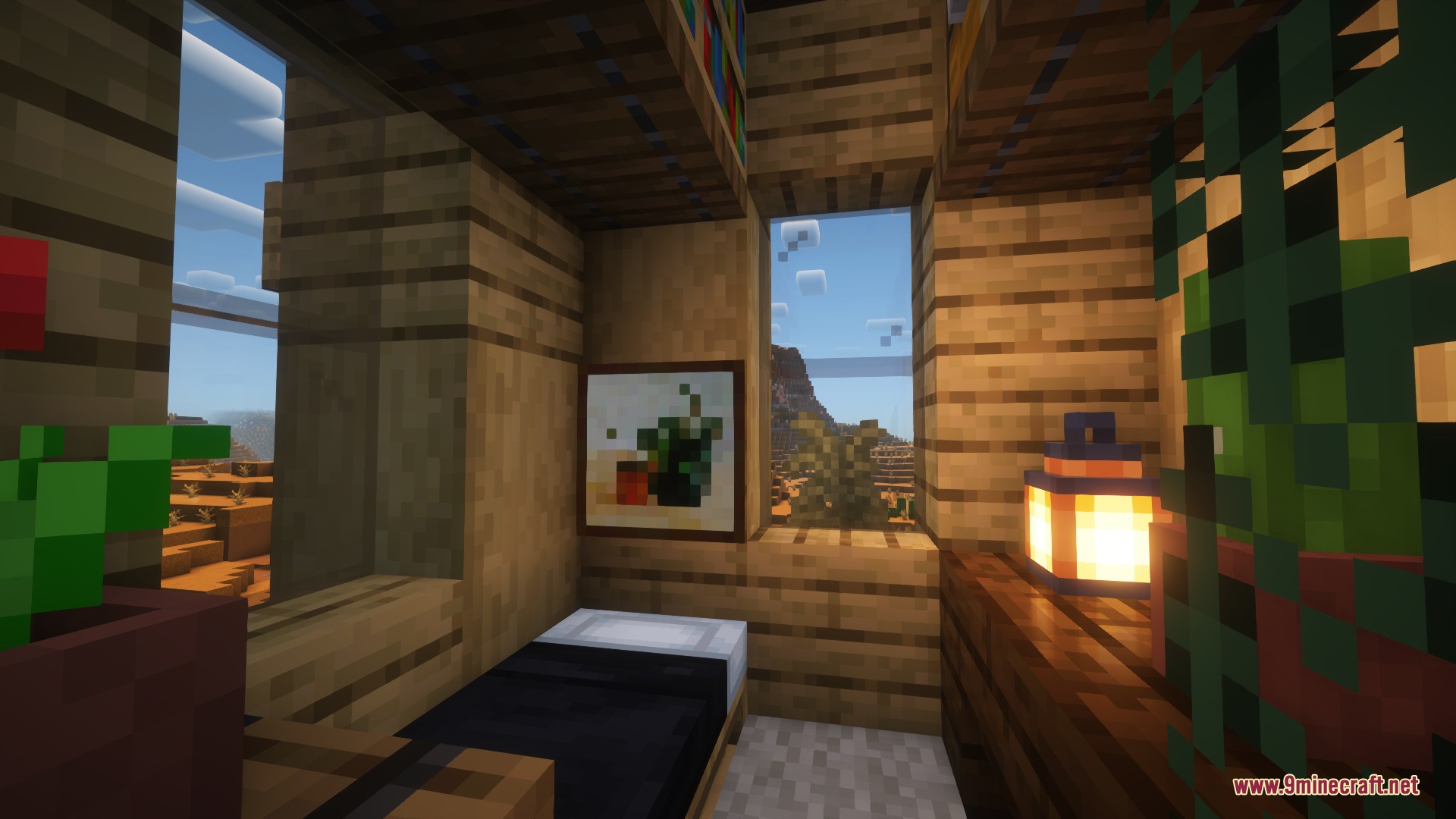 A cozy furnished bedroom with a painting overlooking the badlands biome