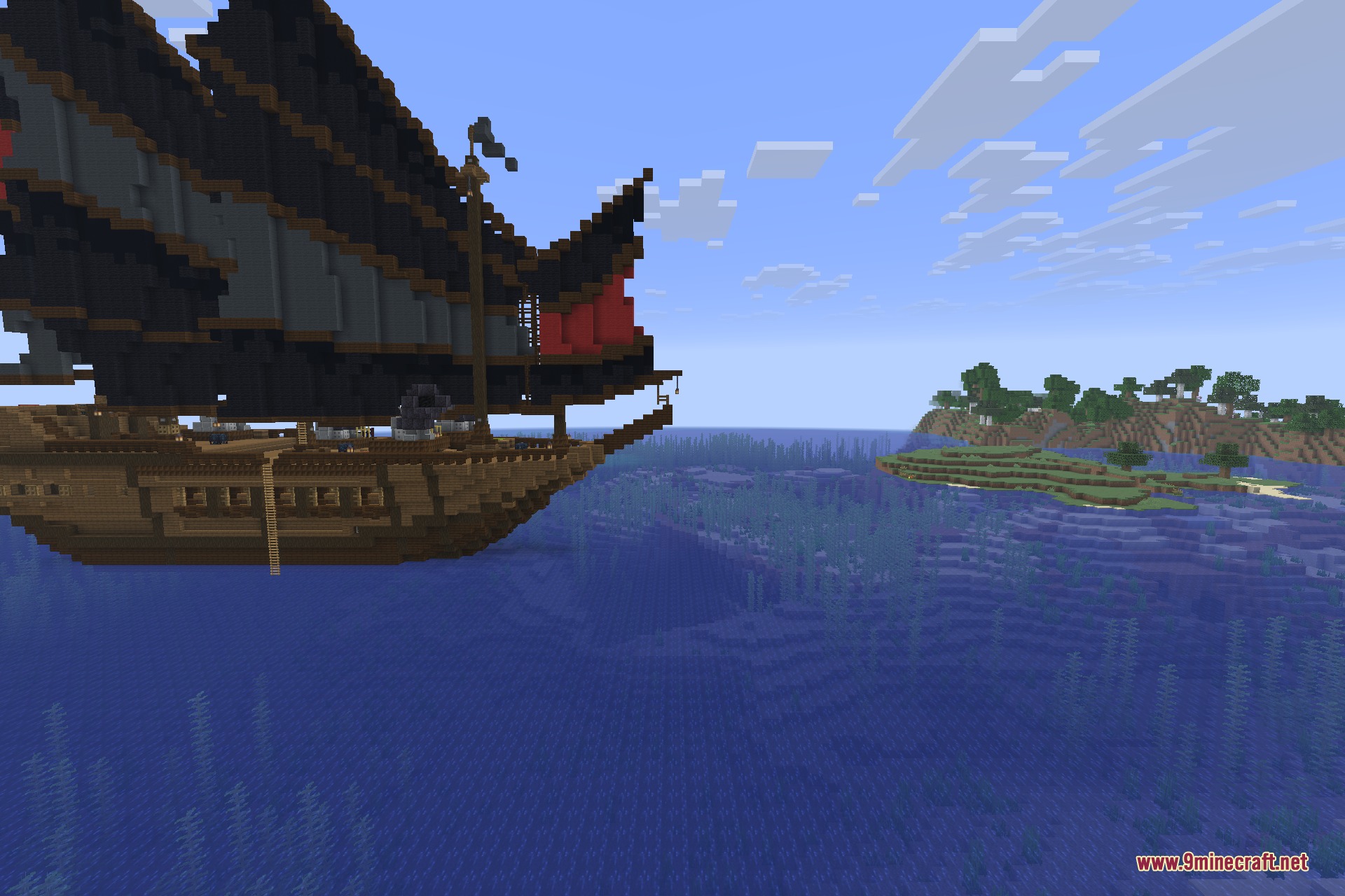 A dark junk with red sails drifting near a coastline