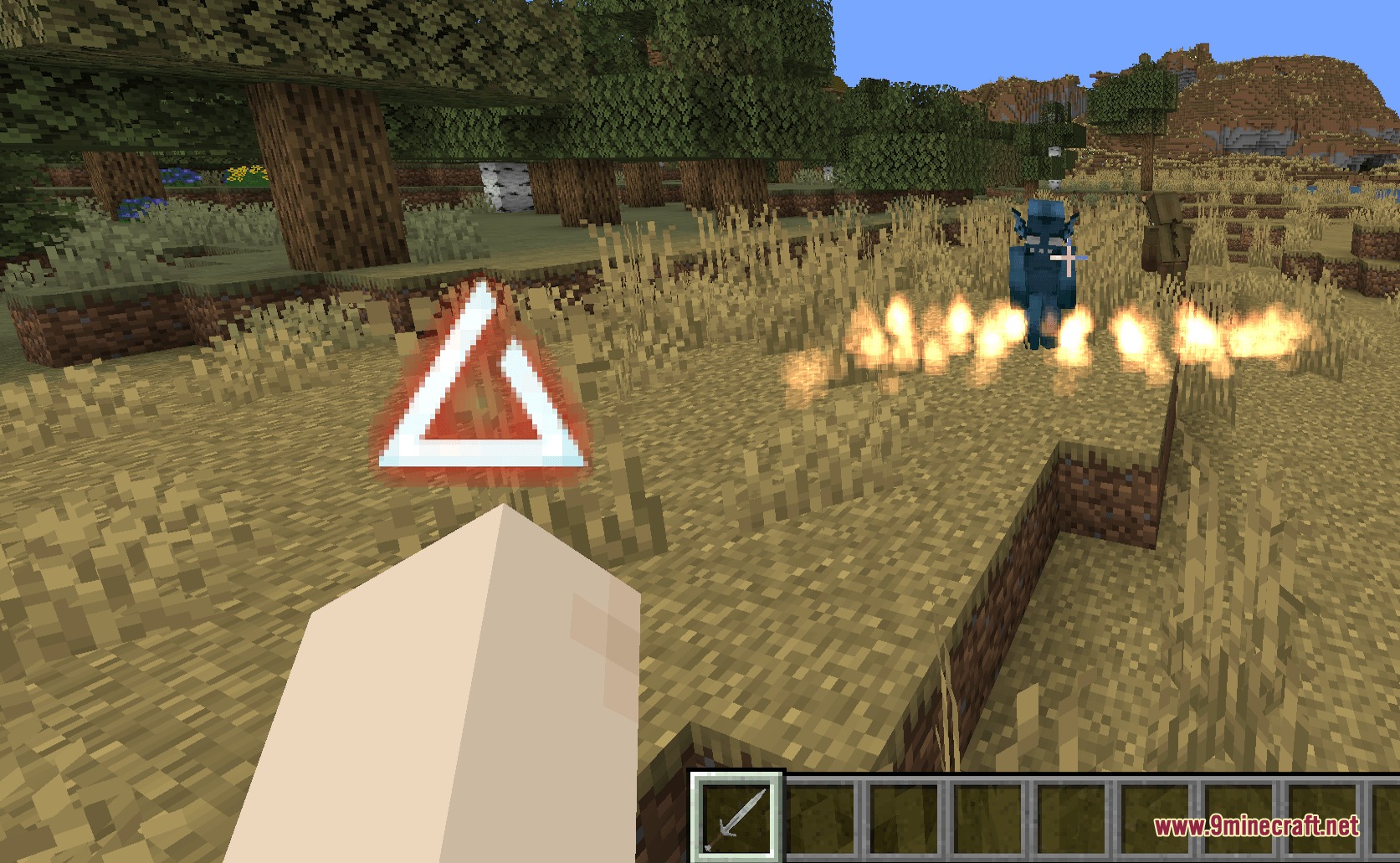 Player casting the Igni sign to unleash fire against monsters in Minecraft