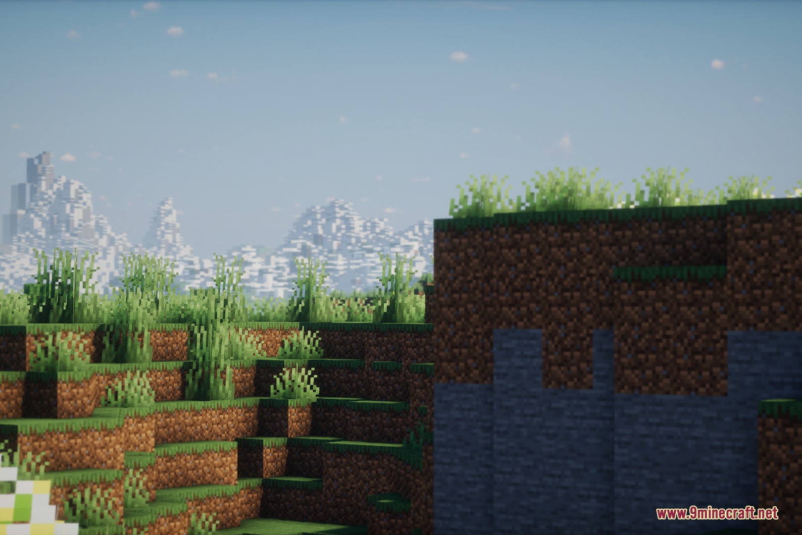 Silver Lens Studio Mod Screenshot 5 Scenic Minecraft landscape with lush green grass and distant snowy mountains using shaders