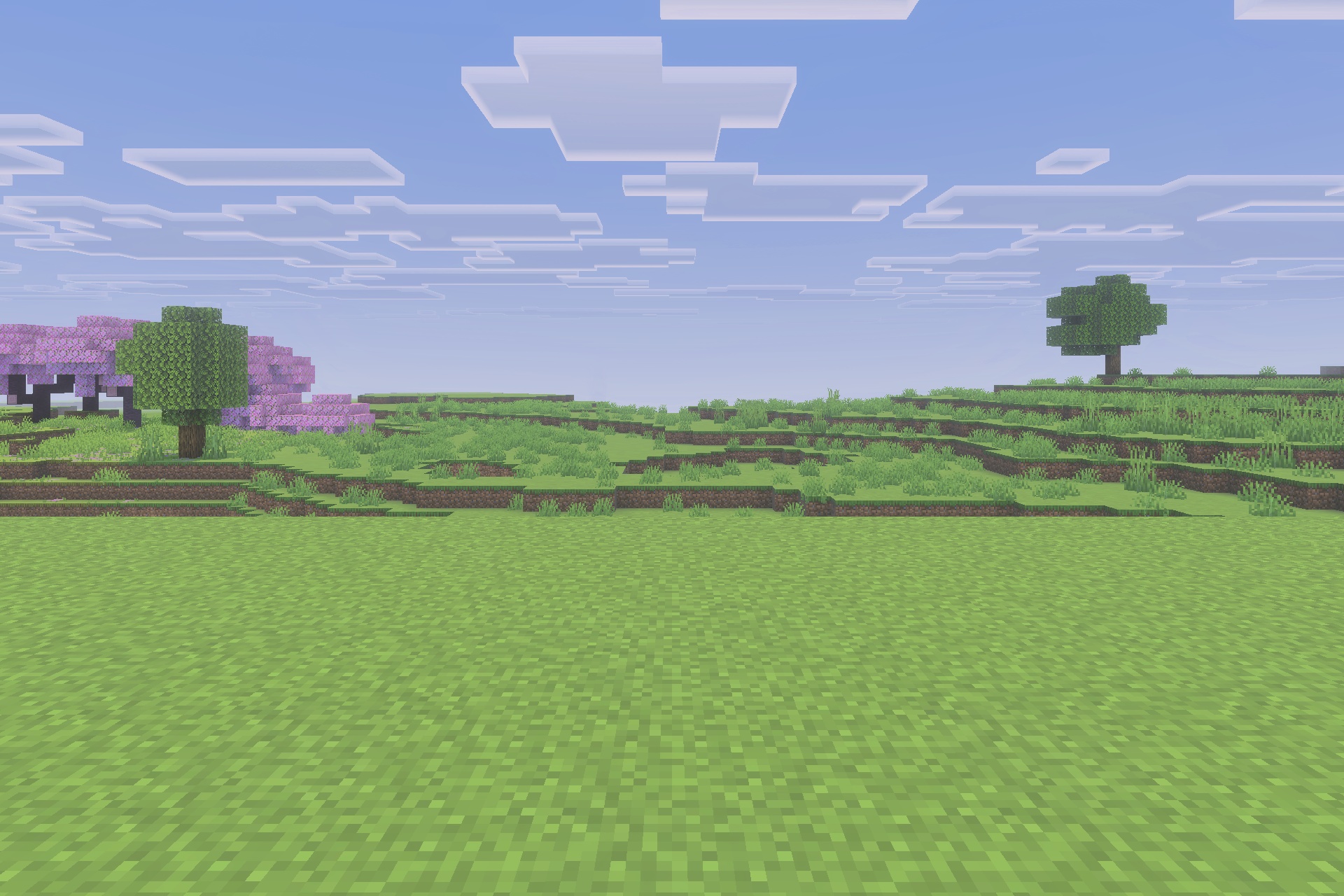 A peaceful Minecraft landscape featuring green grass and a pink cherry tree