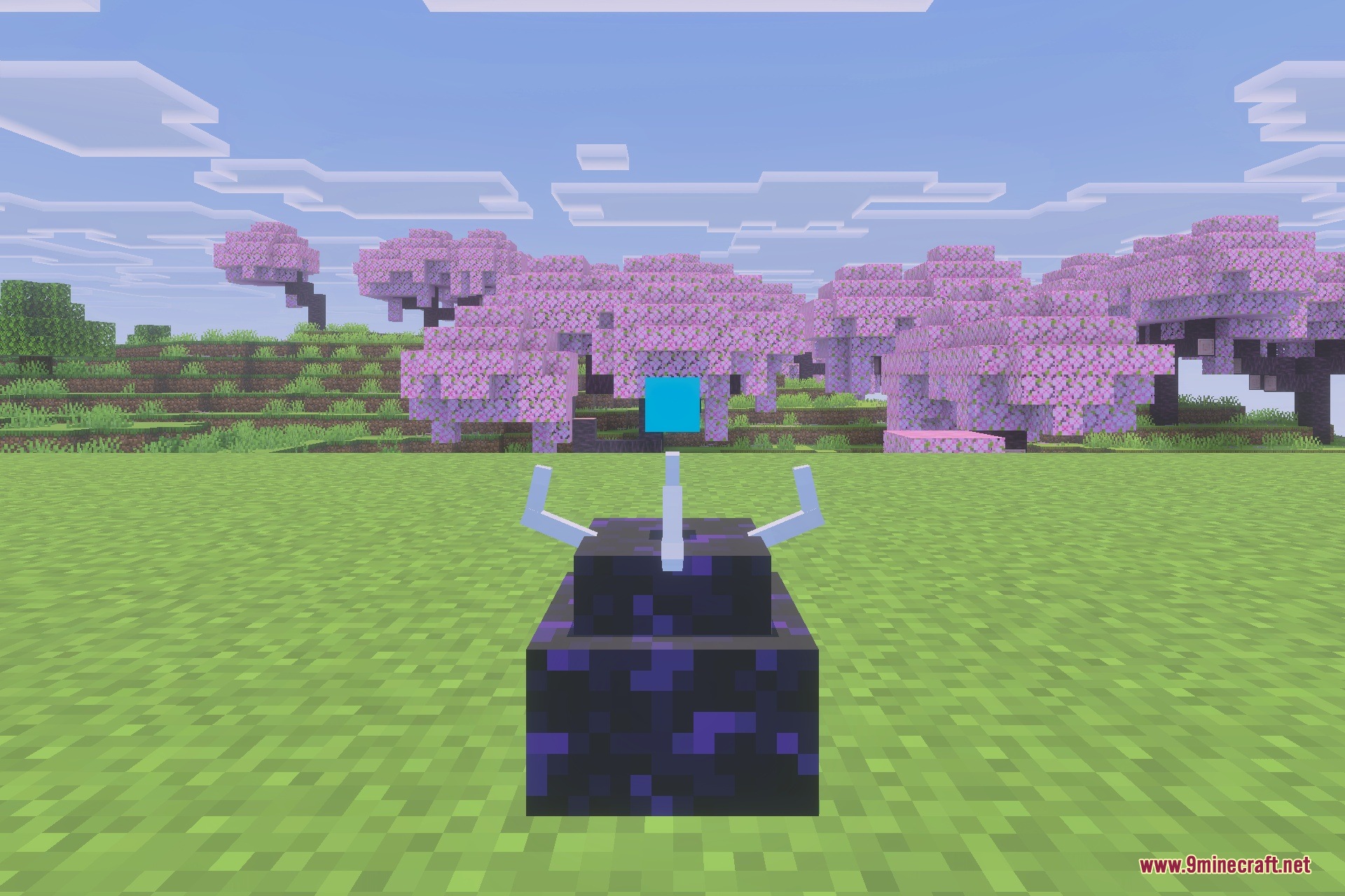 A Simulation Core placed on obsidian blocks in a cherry blossom biome