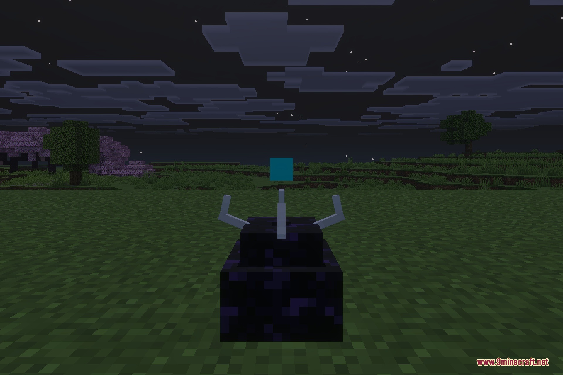 A Simulation Core block placed on the ground under the night sky