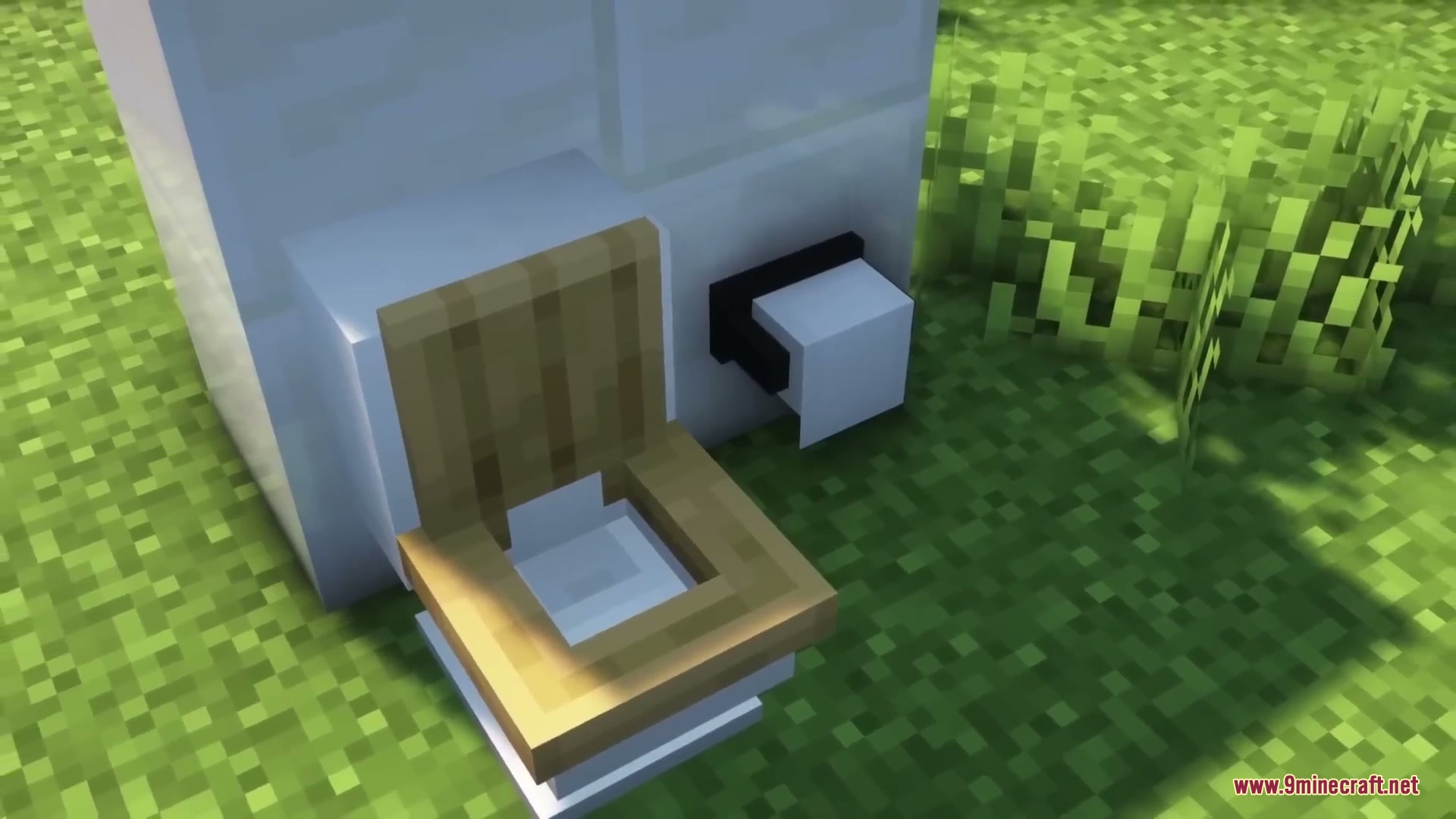 Sleek Living Spaces Mod Screenshot 14 A modern white toilet and toilet paper roll placed on green grass
