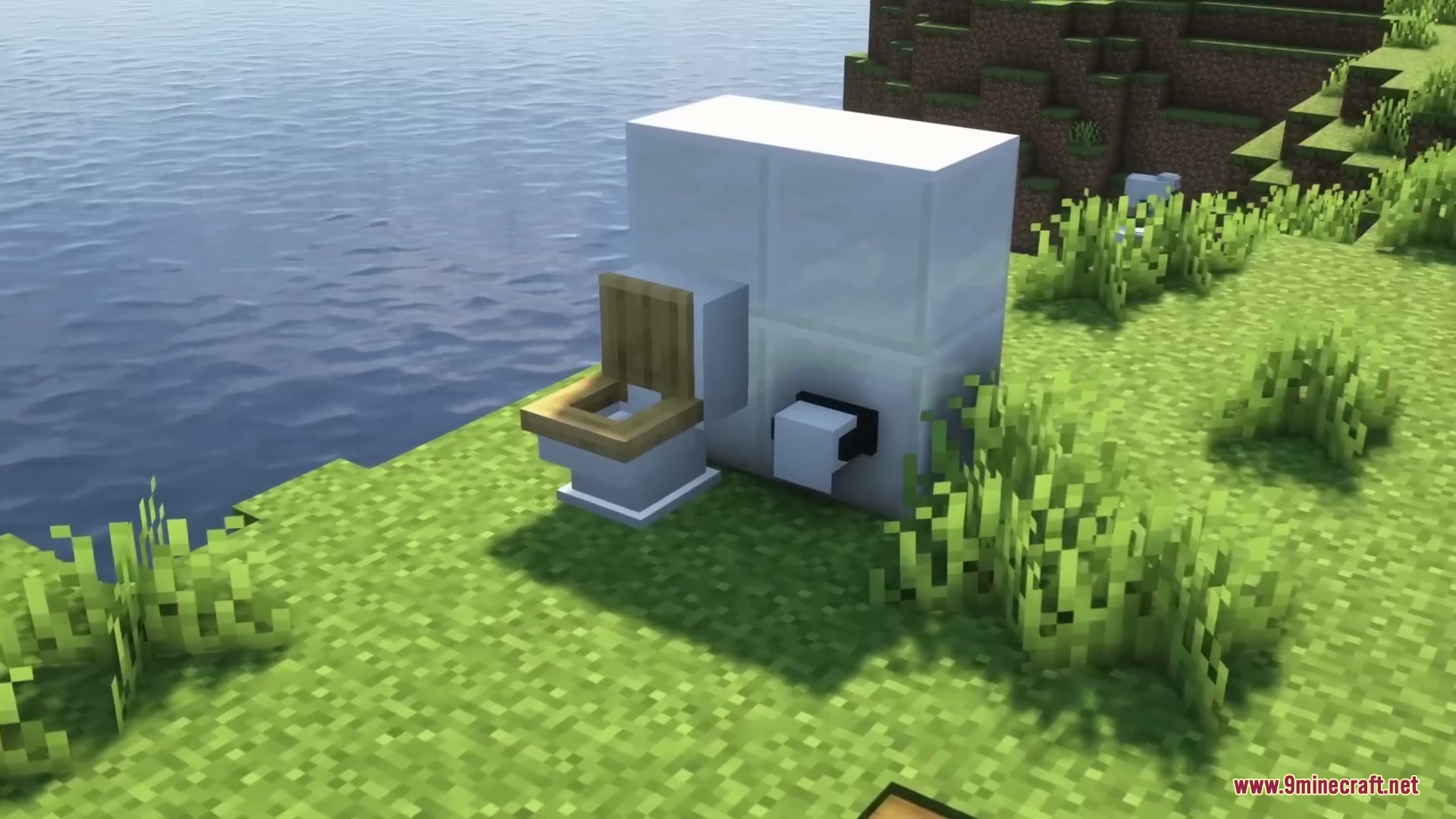 Sleek Living Spaces Mod Screenshot 4 A modern white toilet and toilet paper roll placed near the water