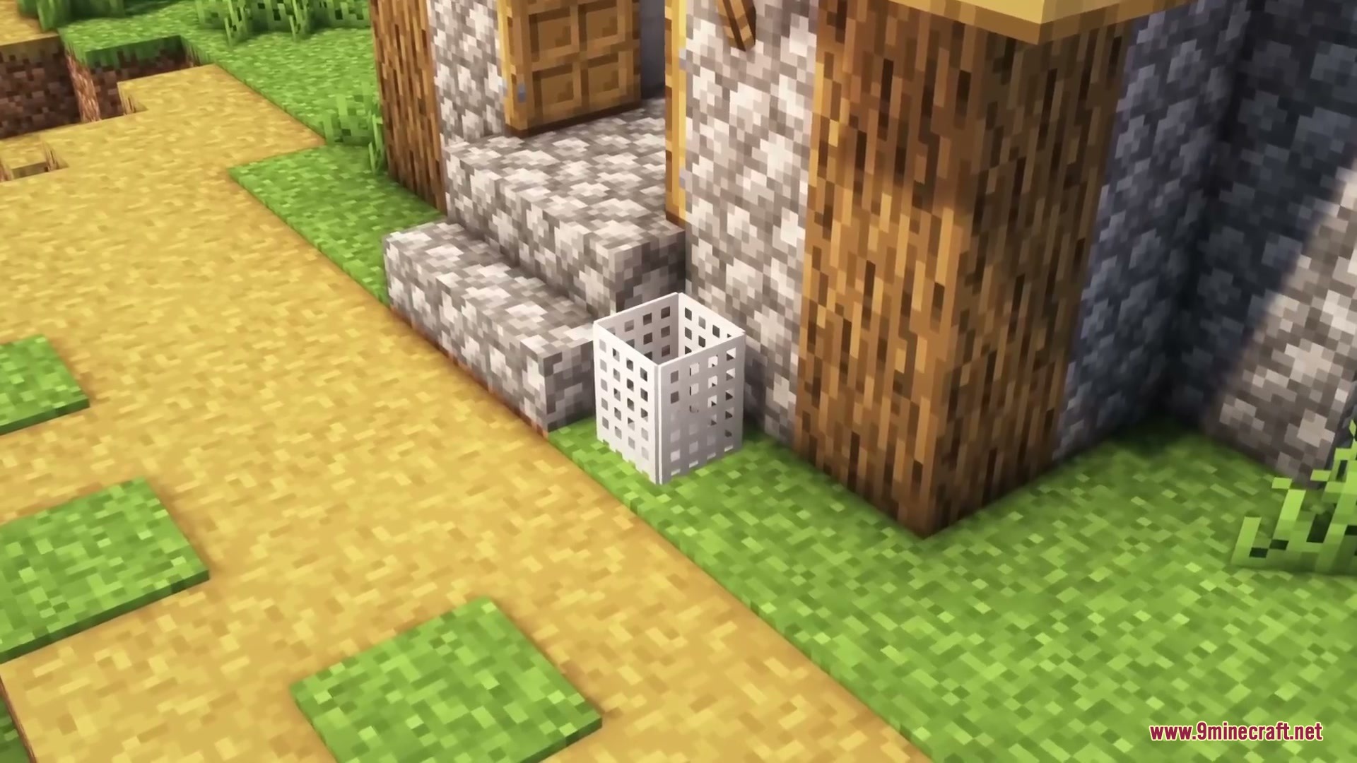 Sleek Living Spaces Mod Screenshot 9 A white laundry basket placed on the grass outside a Minecraft house