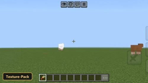 flat grassy plain with a sheep and pig, clear sky