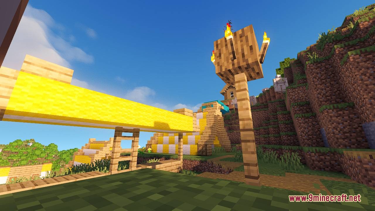 Sovereign Frontier Realms Mod Screenshot 4 A tall wooden torch post stands near yellow and white tents in a village