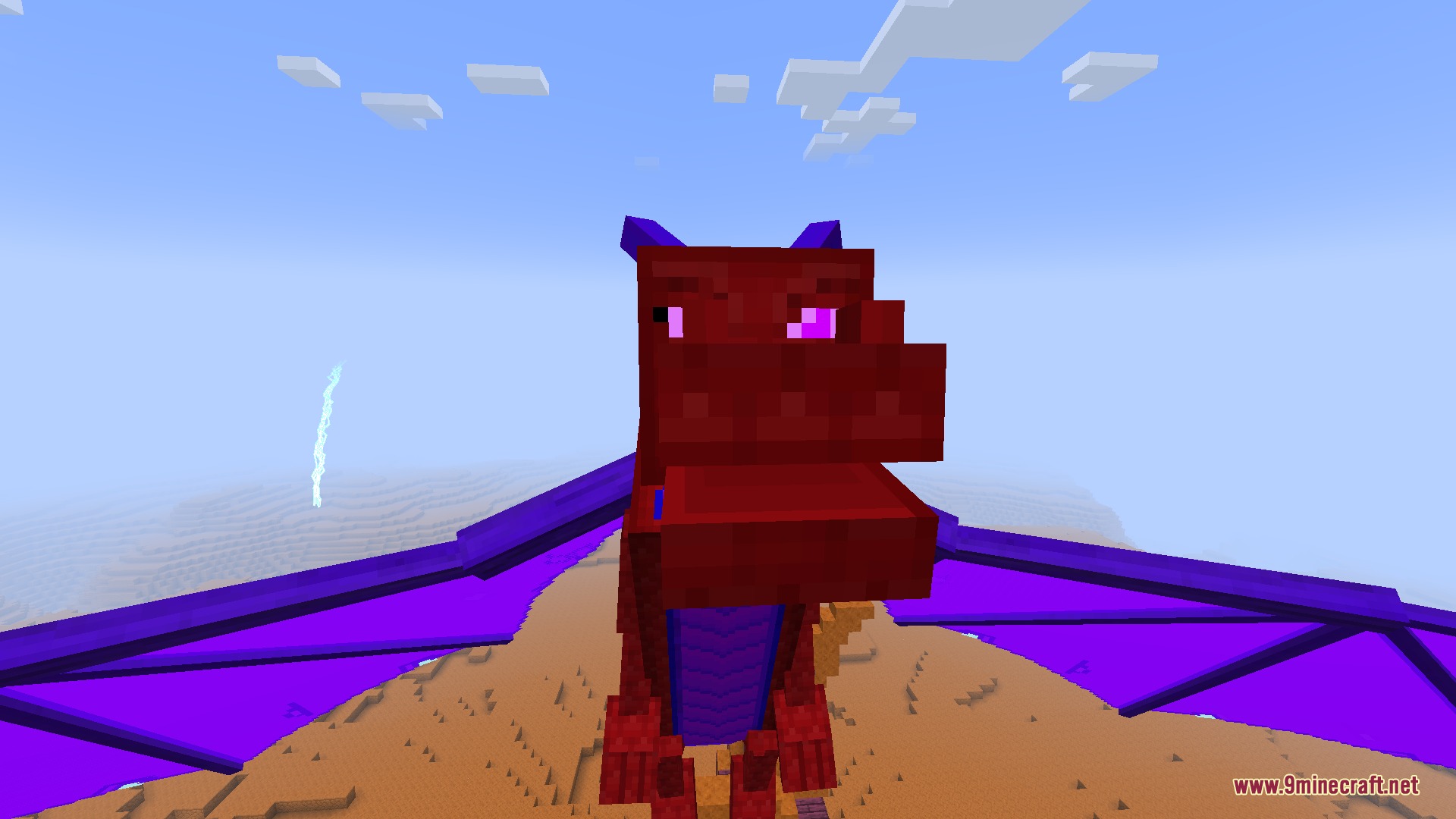 Spinjitzu Craft Legacy Mod Screenshot 5 A red dragon with purple wings looking at the camera in a desert