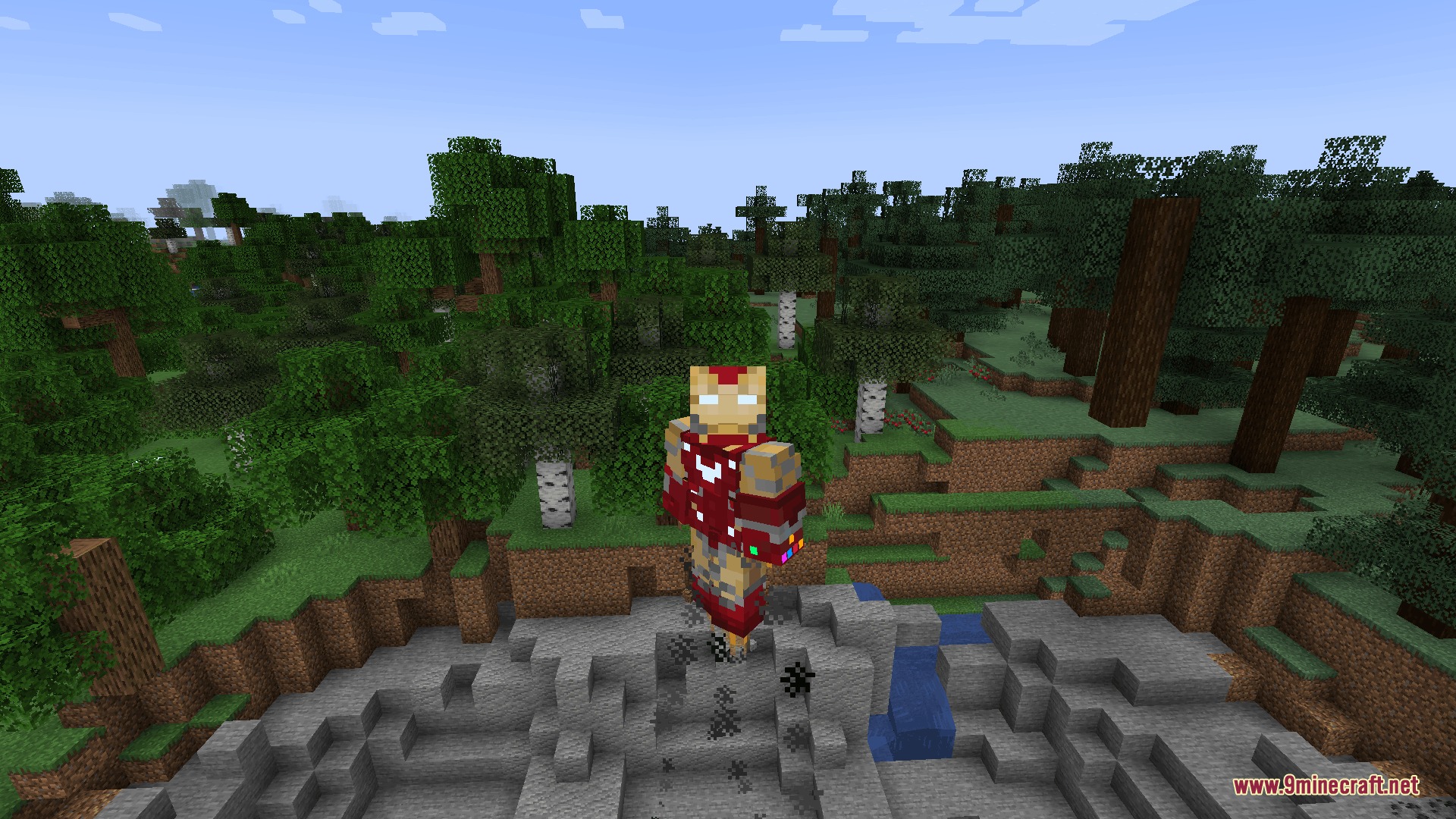 Stark Cosmic Fusion Mod Screenshot 1 Minecraft player in Iron Man armor using an Infinity Gauntlet in the forest