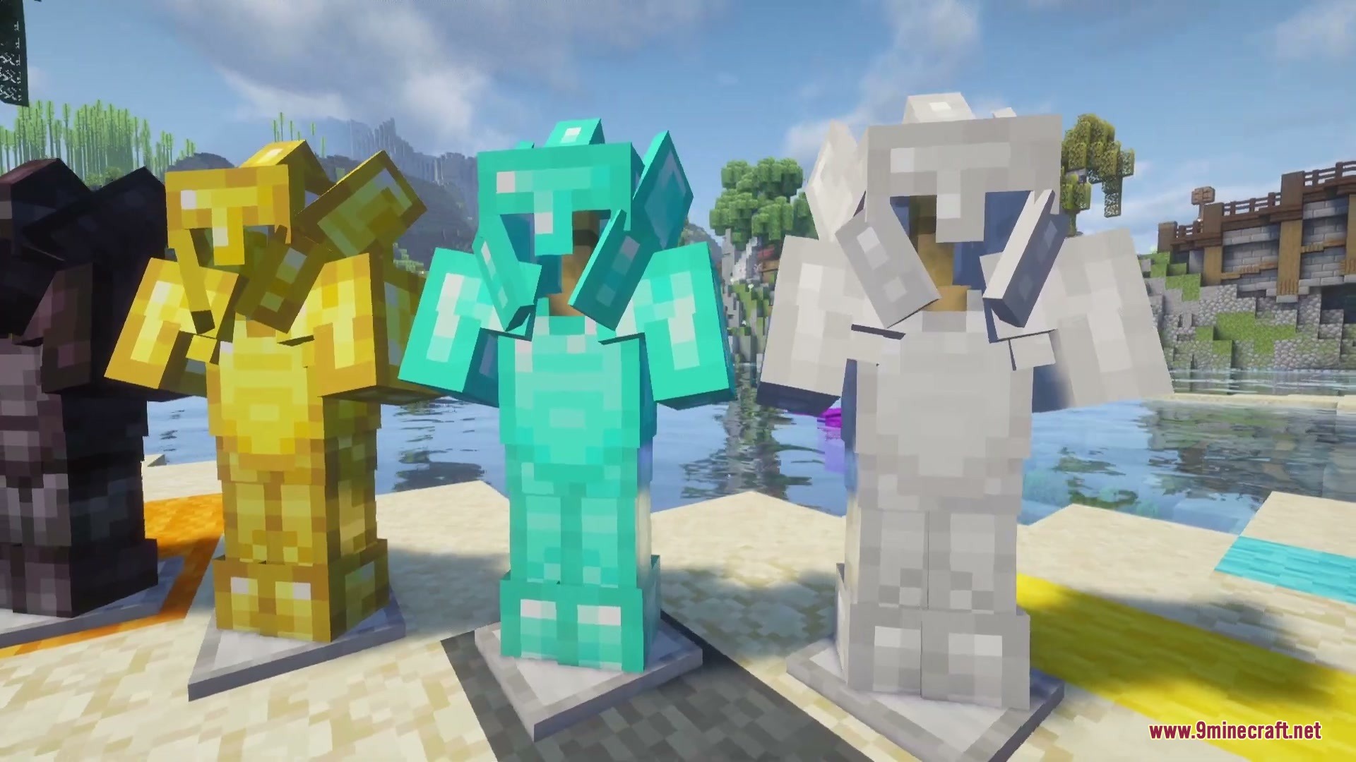 Three sets of knight armor displayed on stands near the water