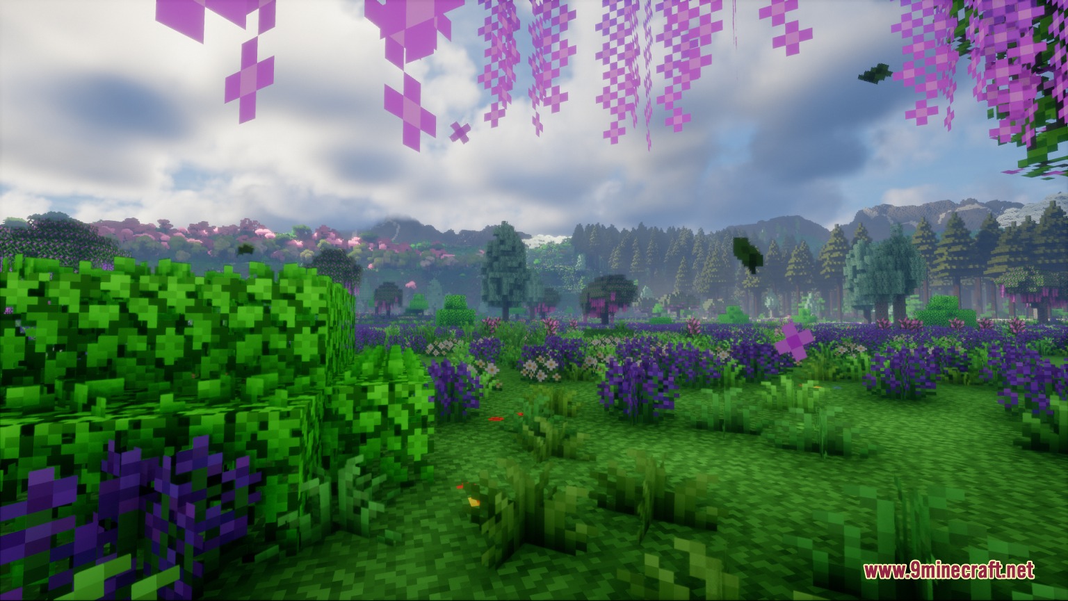 Surging Ethereal Peaks Mod Screenshot 2 Vibrant meadow filled with purple flowers and pink blossoms beneath a mountain range