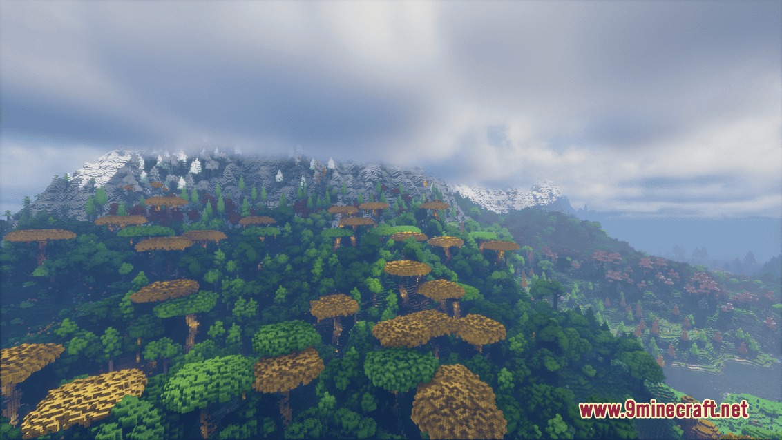 Surging Ethereal Peaks Mod Screenshot 5 Lush forest with colorful flat topped trees beneath massive snow capped mountain peaks