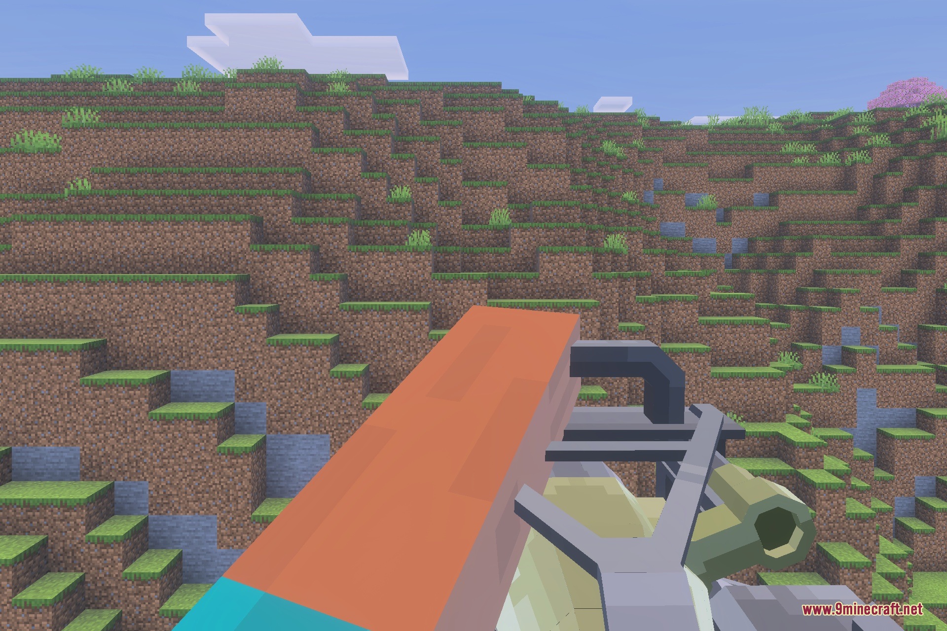 Player aiming a heavy firearm at a grassy hillside