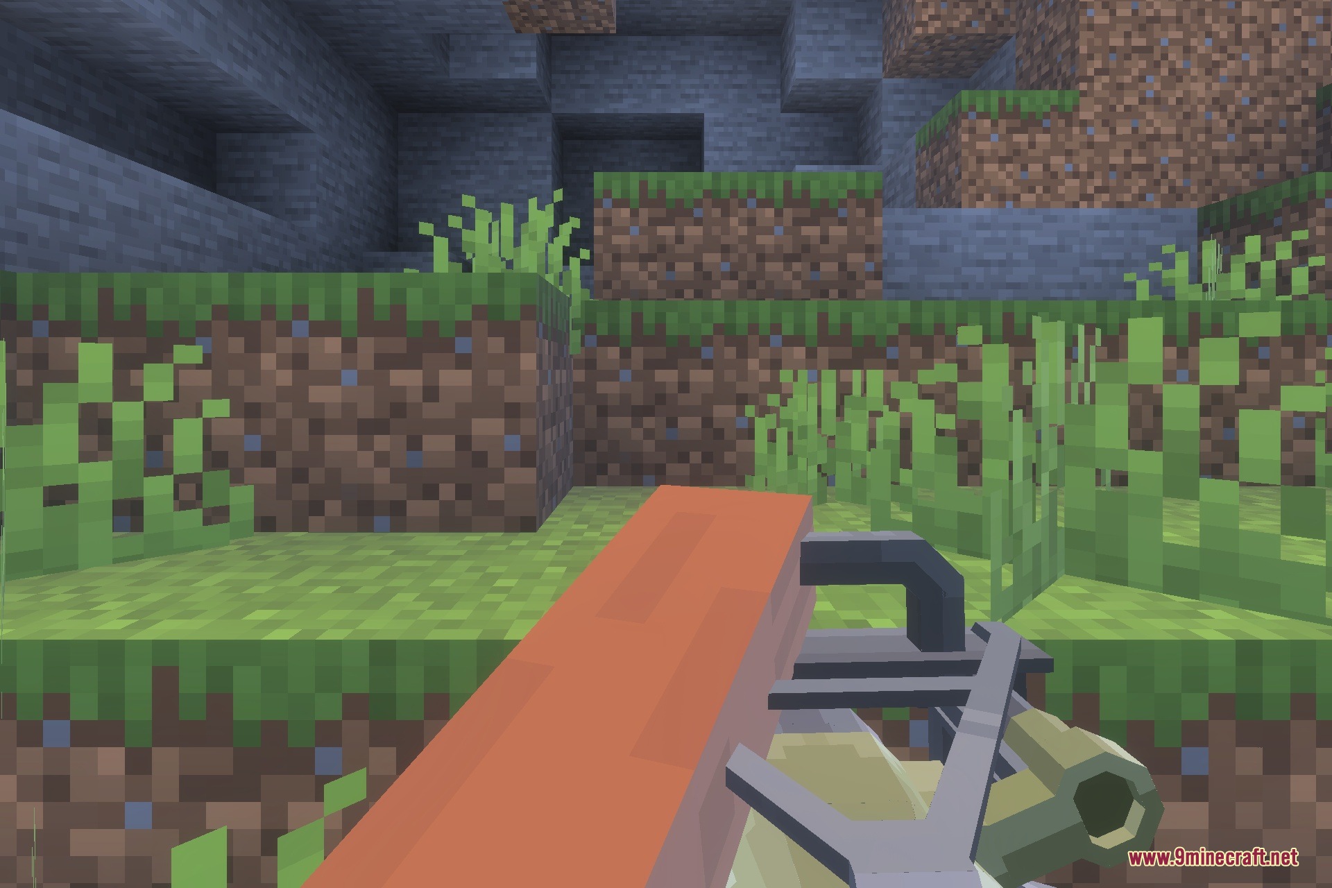 First person view of player holding a heavy minigun