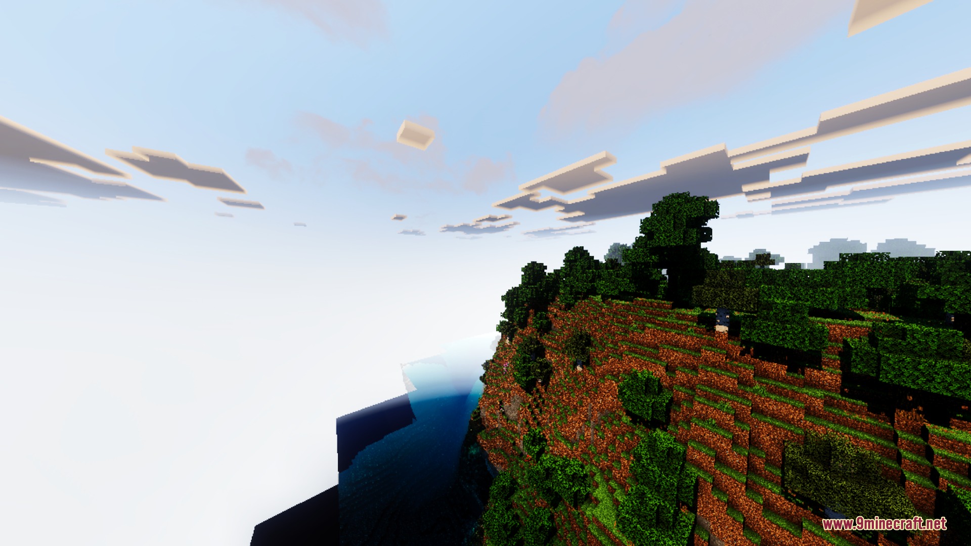 Dynamic reflections appear on the water surface near a lush green forest cliff