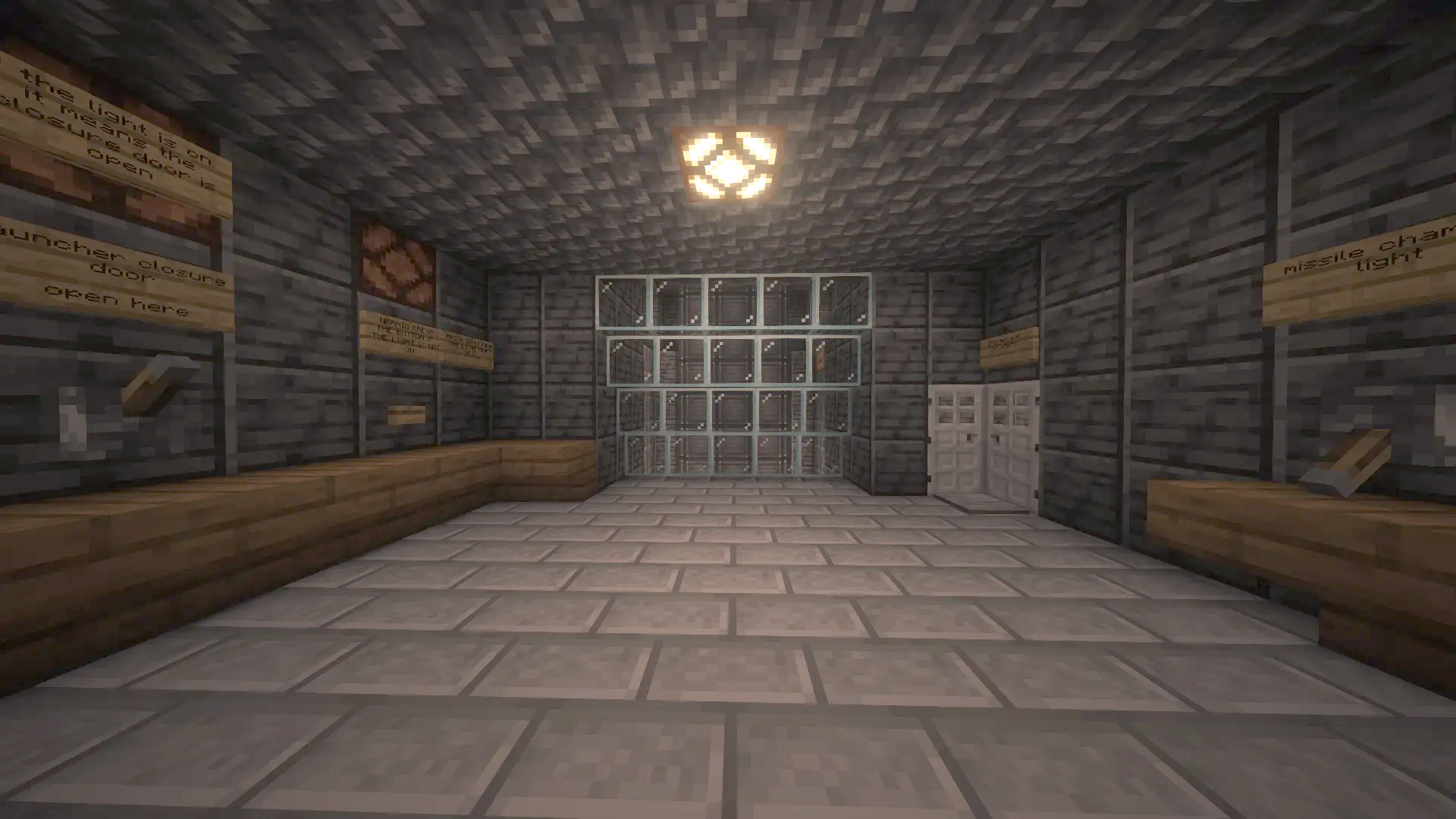 The Missile Schematic Screenshots 2 A dark underground control room featuring stone walls and various redstone switches
