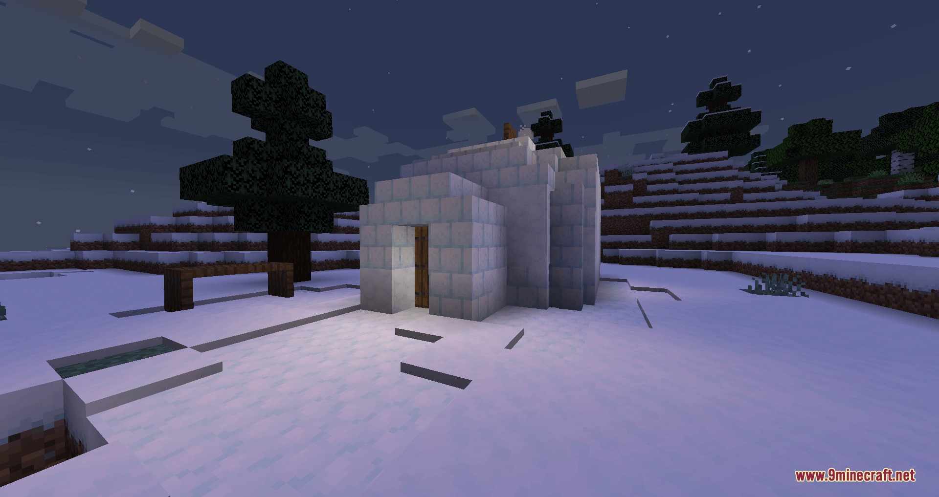 Universal Masonry Spectrum Mod Screenshot 3 A small igloo built with snow bricks in a snowy landscape at night
