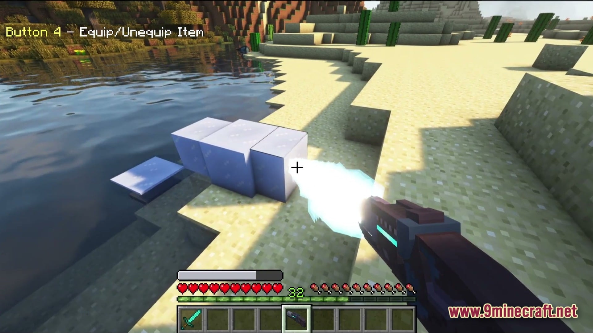 Vanguard Dawn Unleashed Modpack Screenshot 4 A player uses a futuristic energy weapon to freeze water into ice blocks in a desert biome