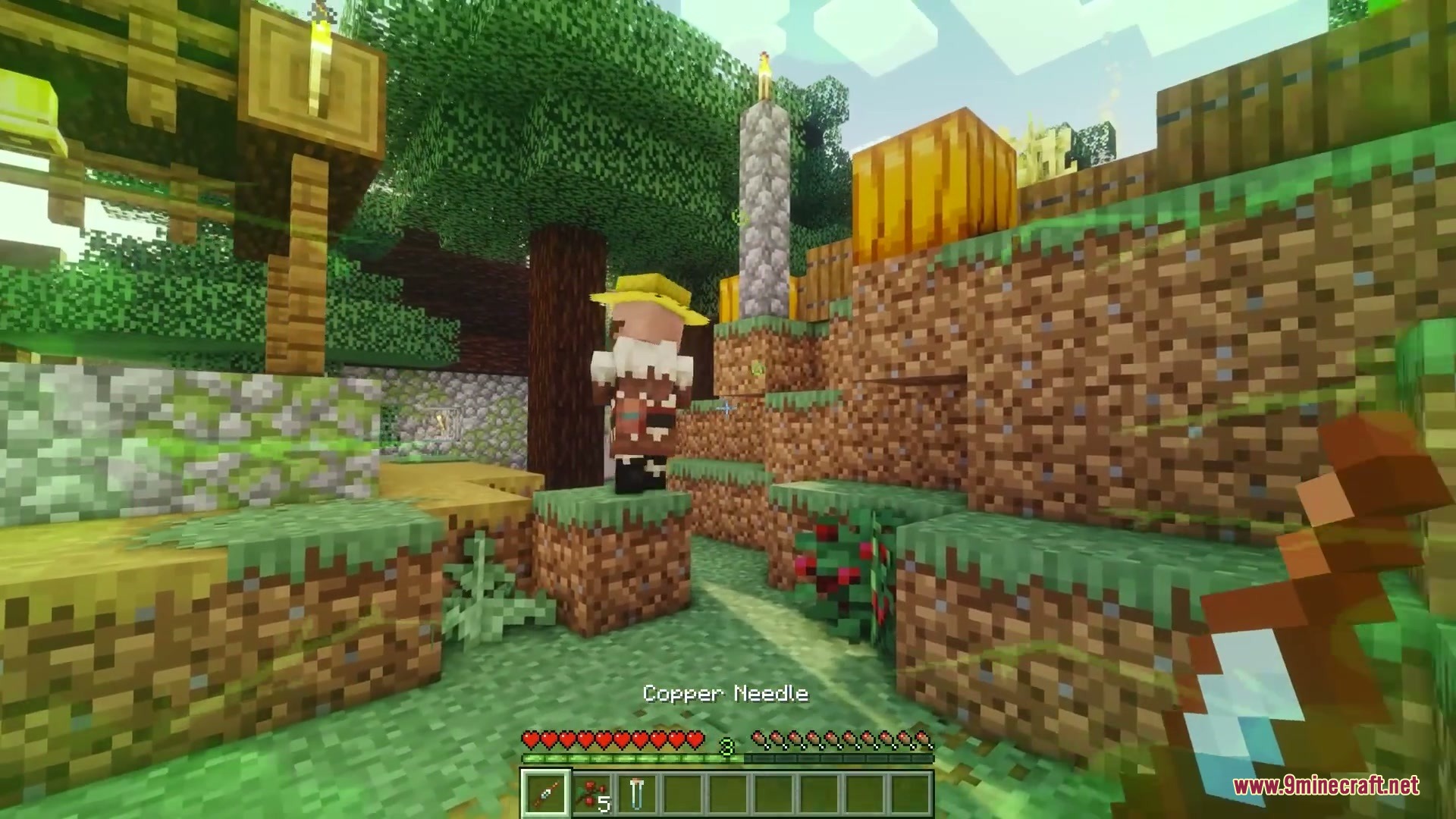 Venomous Reach Mod Screenshot 3 A player holding a Copper Needle item near a villager in a forest