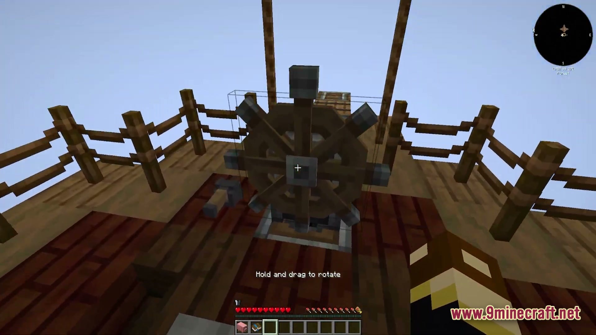 Vessel of the Void Modpack Screenshot 1 A first-person view of a wooden ship's steering wheel on a deck high in the sky