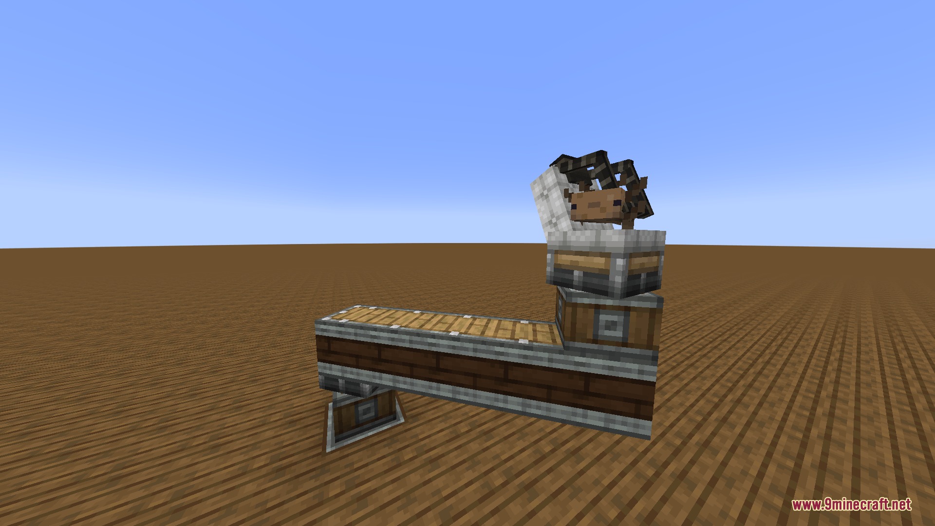 Vibrant Rail Rider Mod Screenshot 4 An axolotl sitting in a reclined coaster seat on a moving contraption