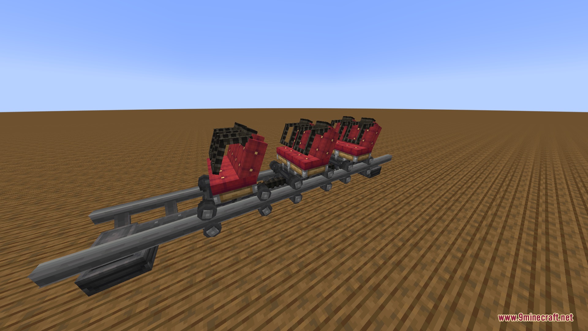 Vibrant Rail Rider Mod Screenshot 6 Three red coaster seats placed on a metal rail track in Minecraft