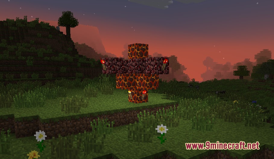 Vile Genesis Mod Screenshot 7 A cross made of magma blocks and netherrack with redstone torches at sunset