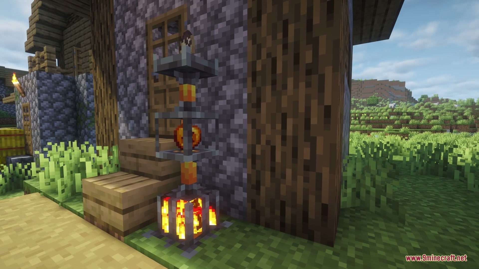 Wilderbound Frontiers Mod Screenshot 5 A tall decorative light fixture made of iron bars and fire blocks