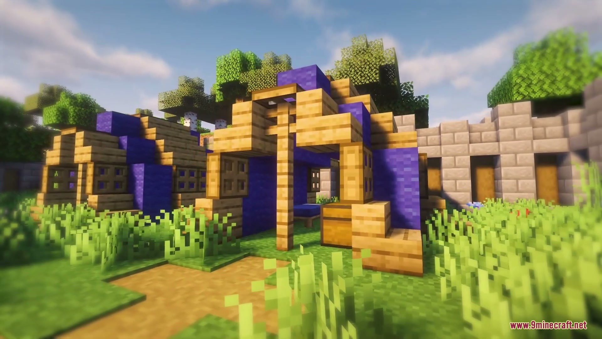 Cozy blue tents and wooden structures located in a vibrant forest biome