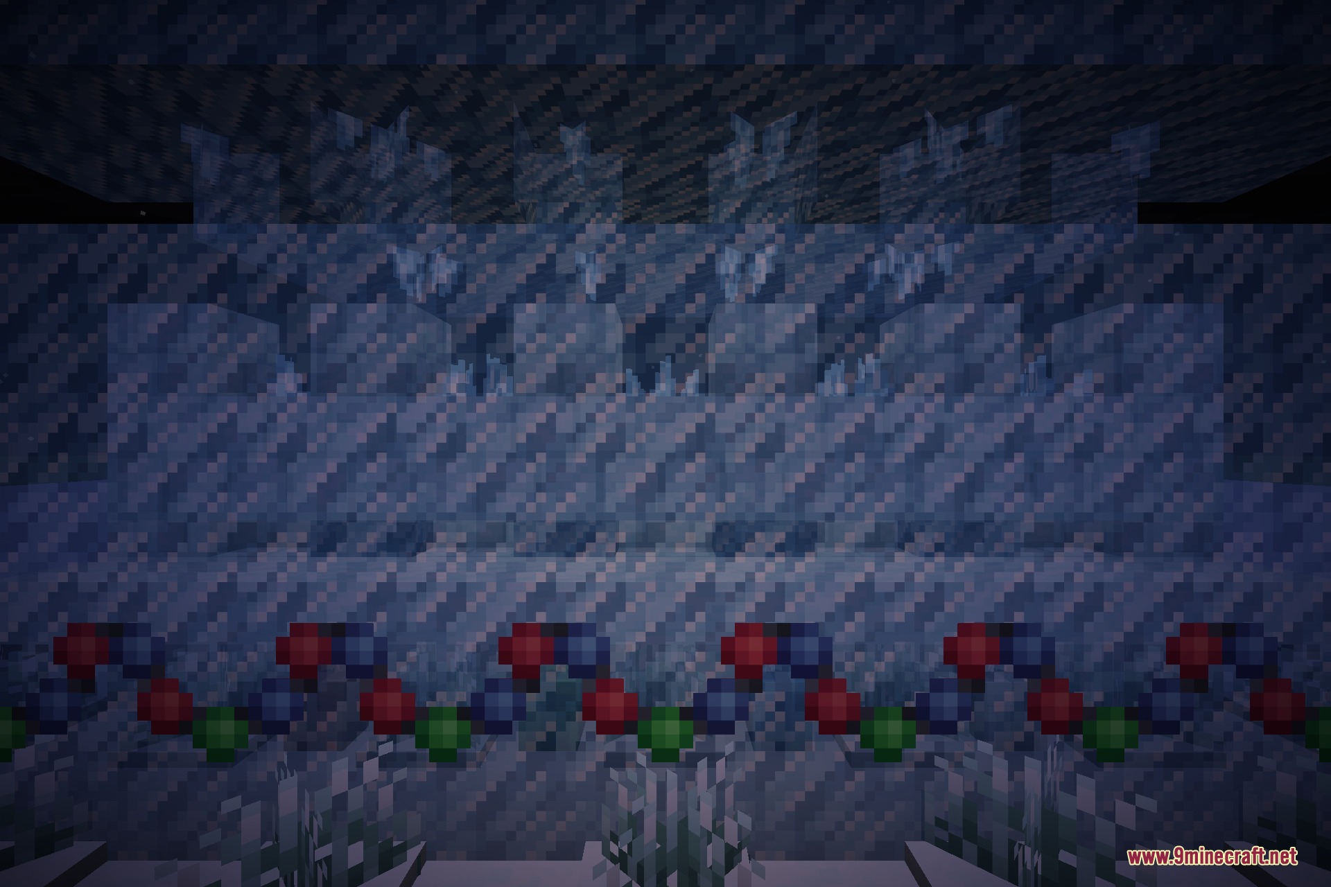 A festive night scene with gift boxes, garland lights, a snowguy and decorated winter mobs